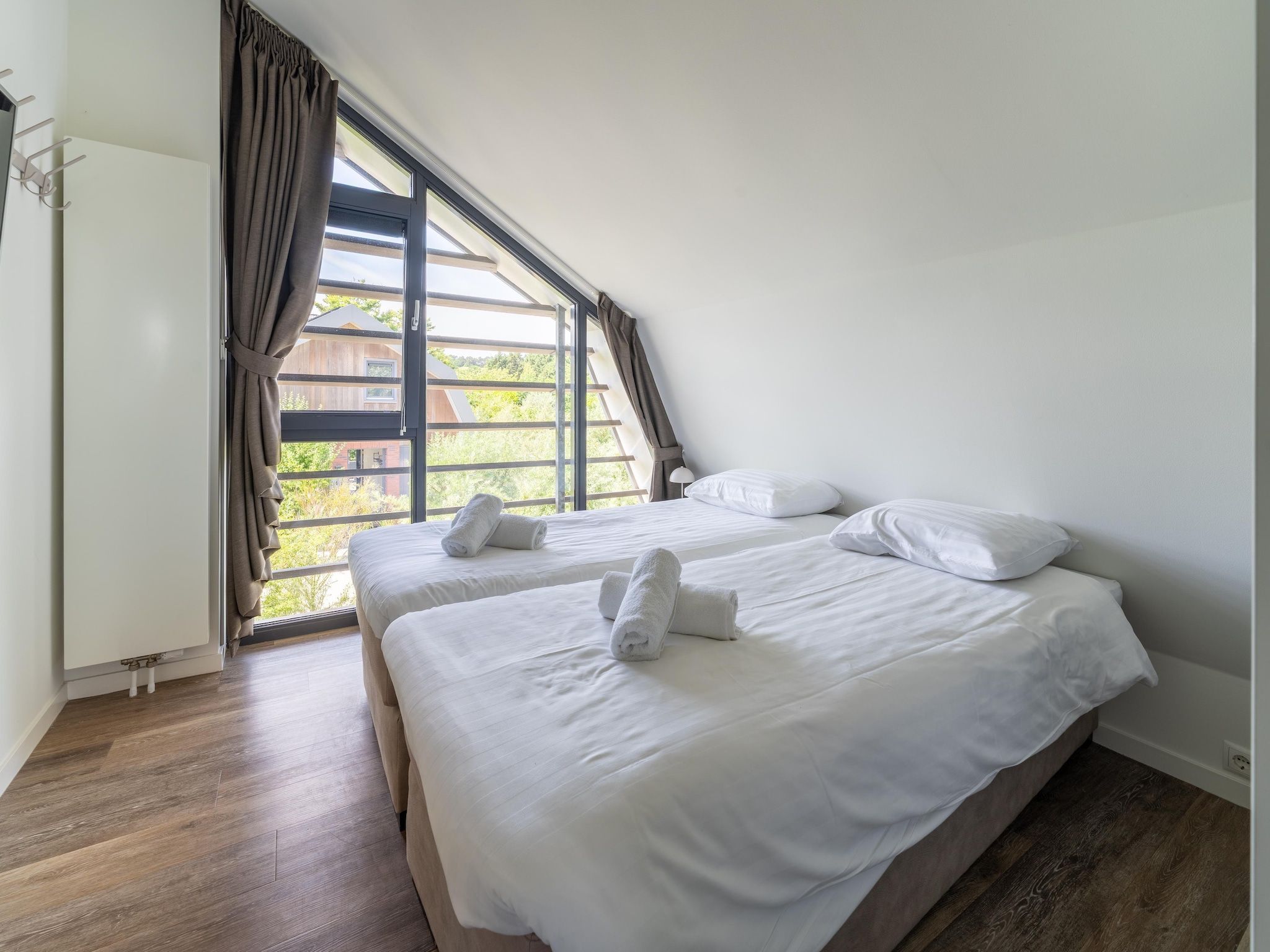 Een slaapkamer van Onder de molen in Egmond aan den Hoef