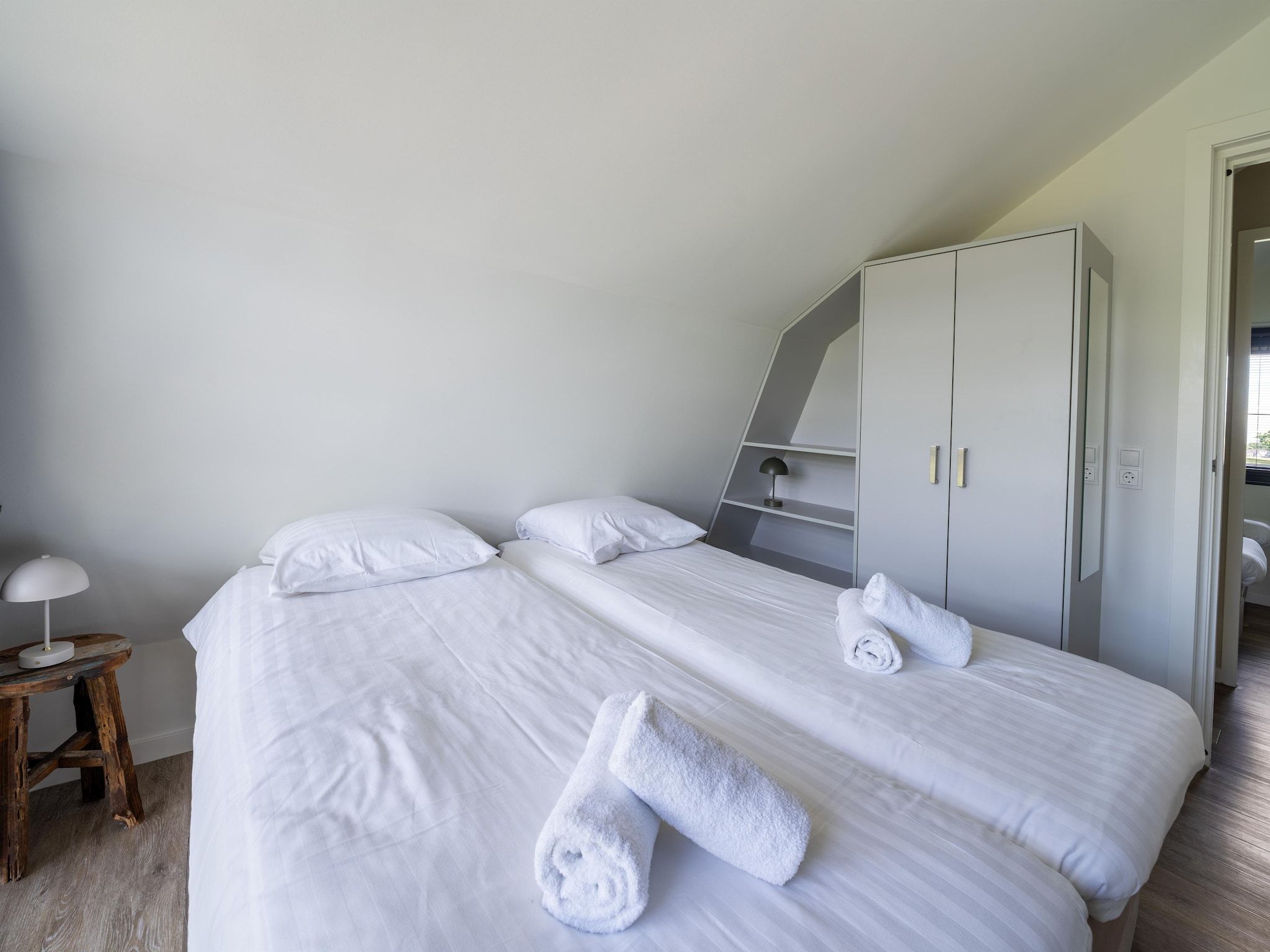 Een slaapkamer van Onder de molen in Egmond aan den Hoef