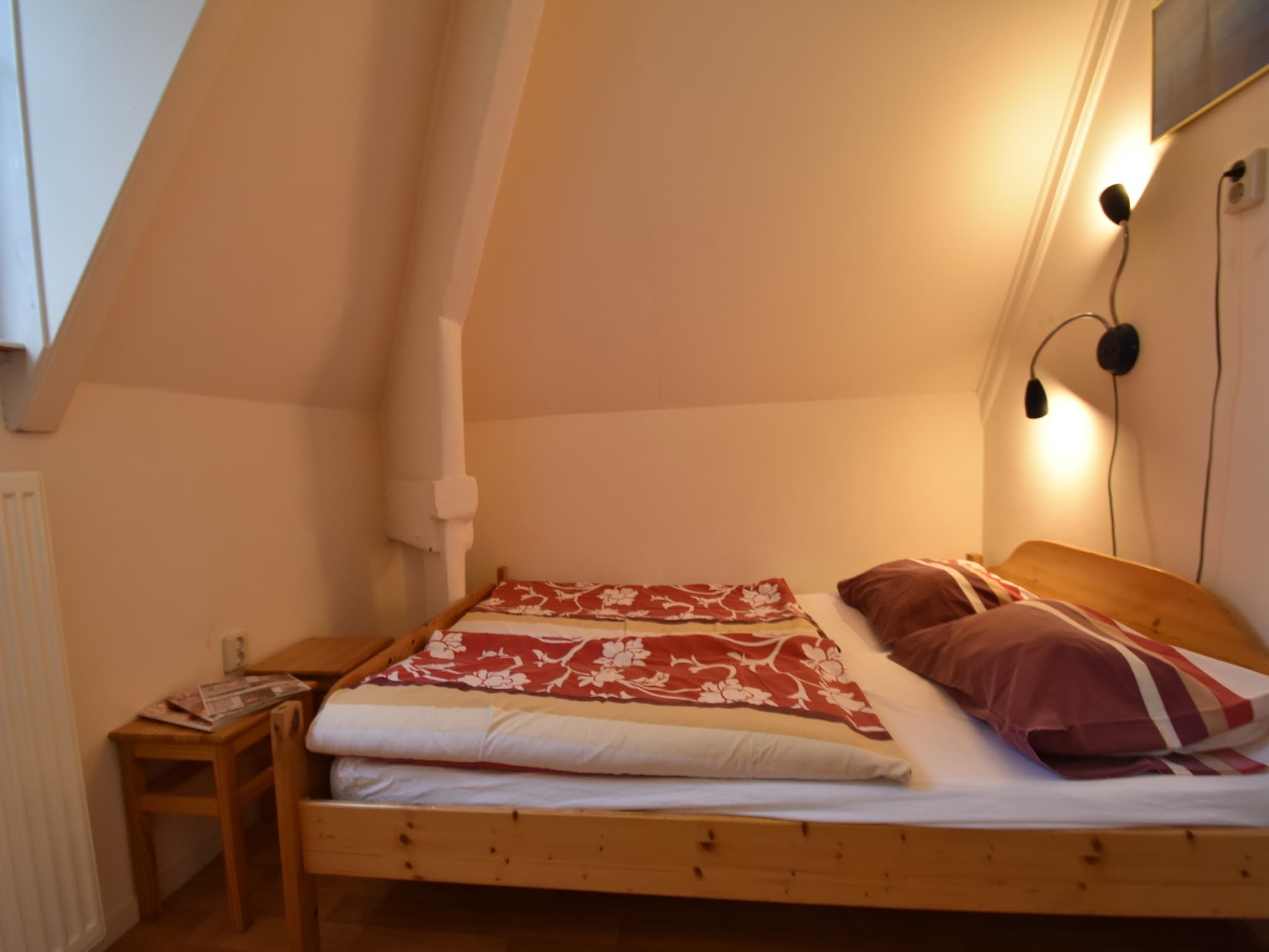 Een slaapkamer van Huize Glory Smaragd in Bergen aan Zee