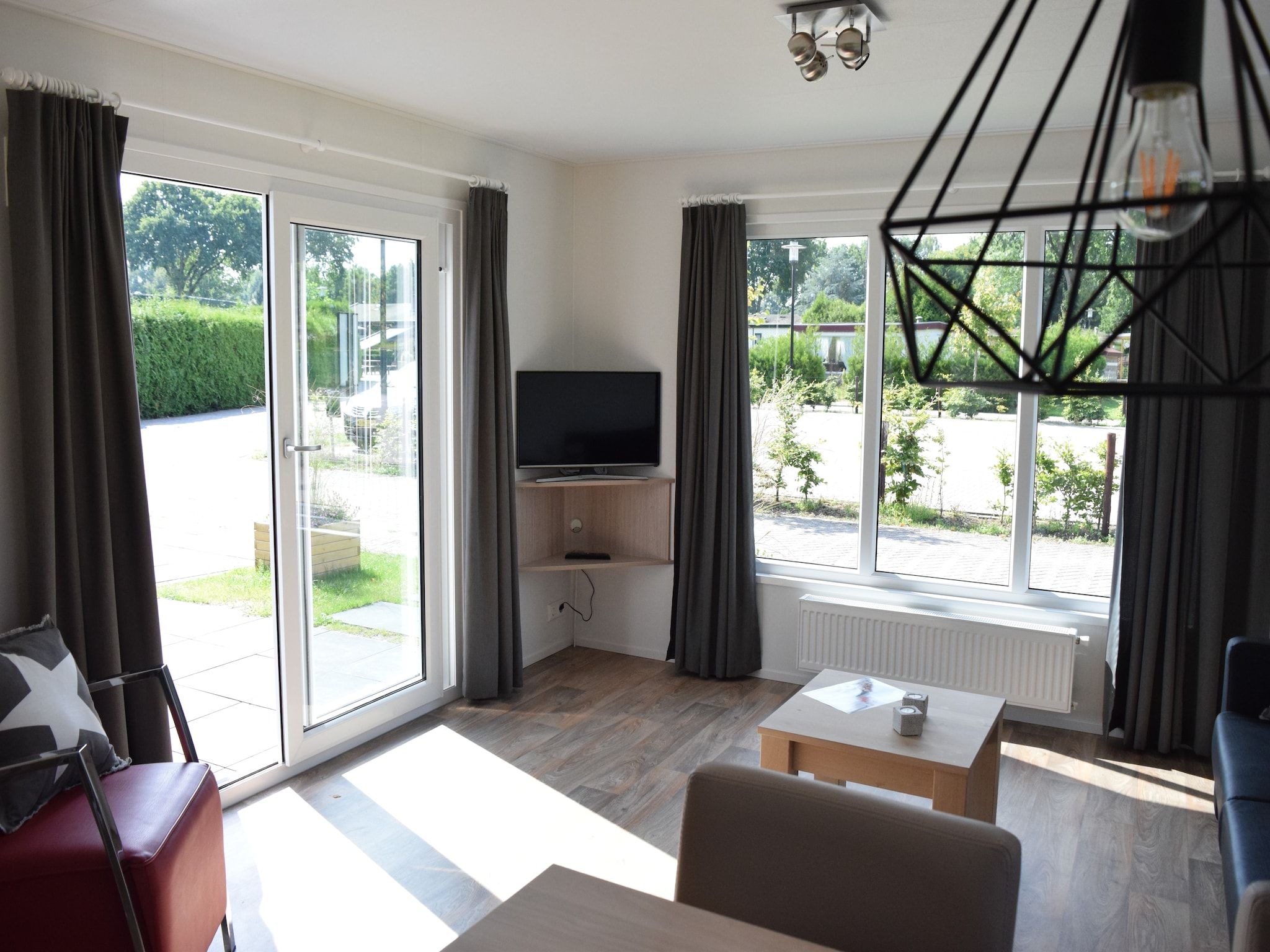 De woonkamer van Recreatiepark de Boshoek 4 in Voorthuizen