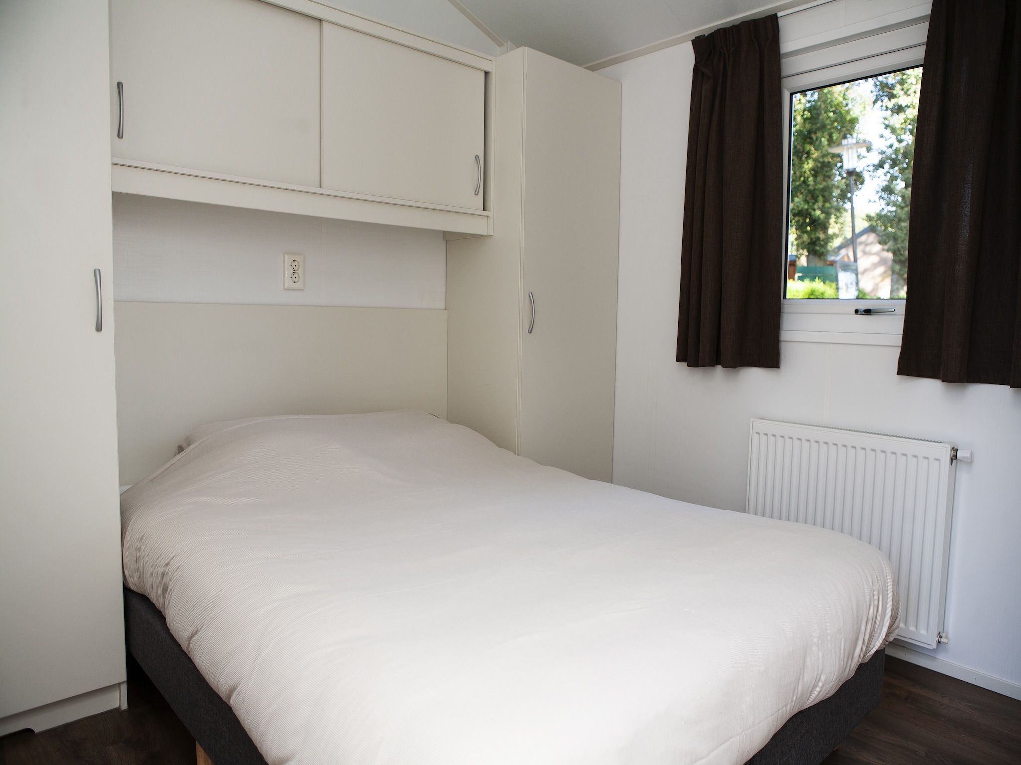 Een slaapkamer van Recreatiepark de Boshoek 5 in Voorthuizen