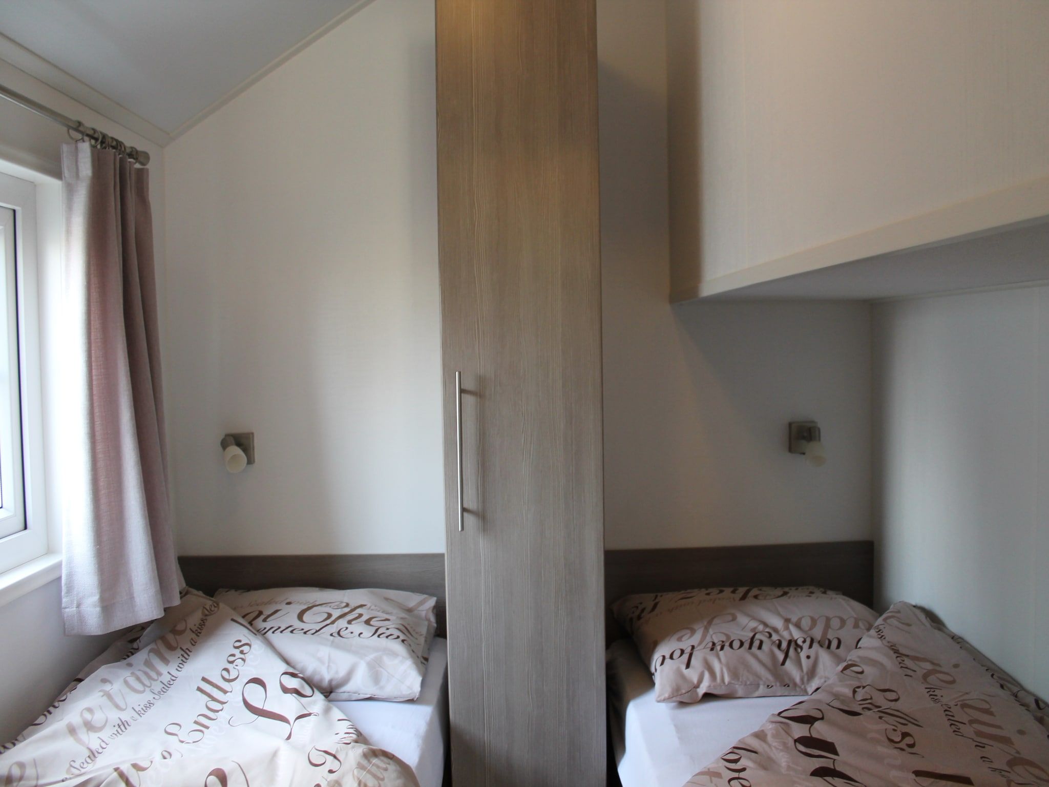 Een slaapkamer van Recreatiepark de Boshoek 7 in Voorthuizen