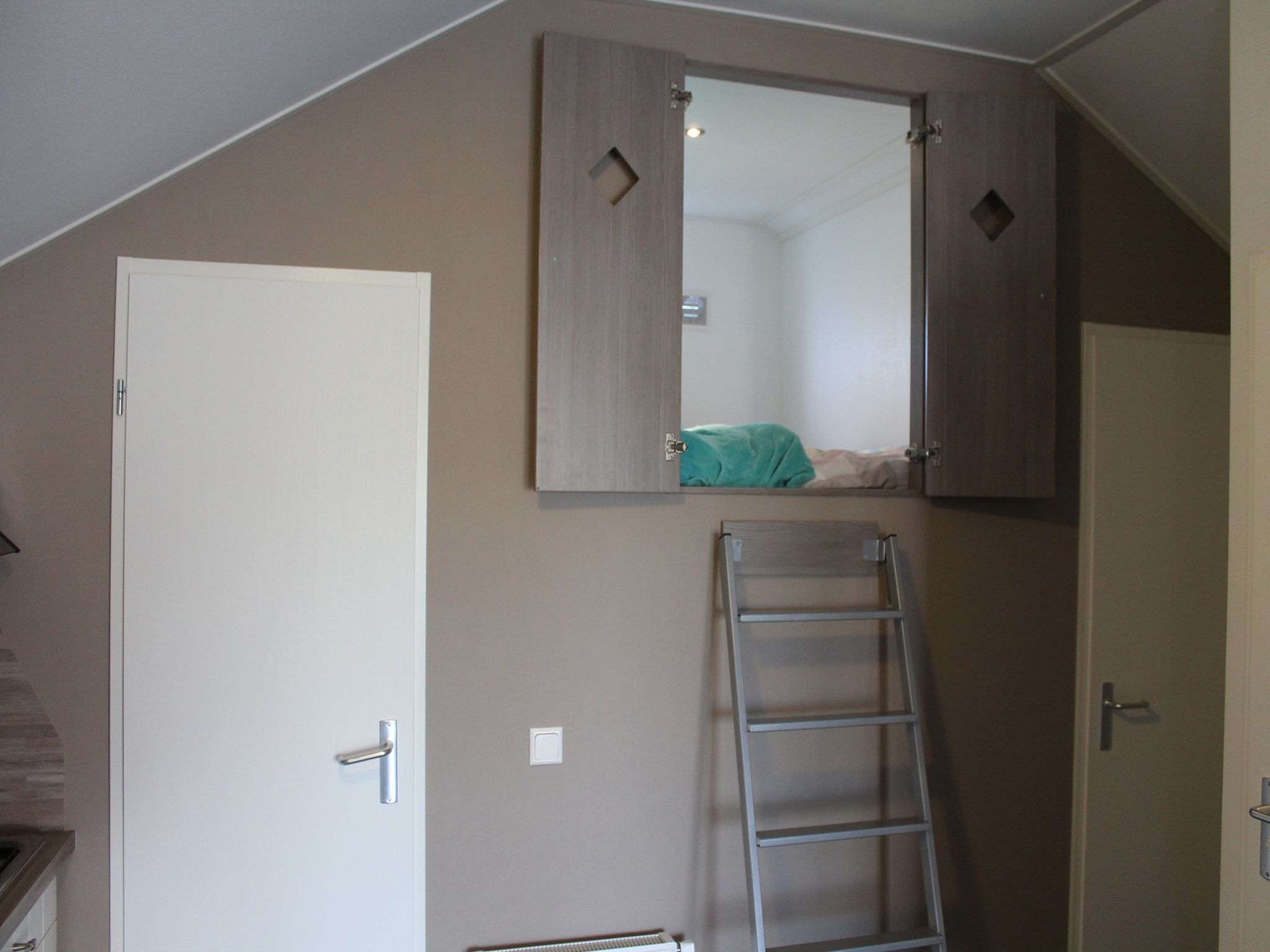 Een slaapkamer van Recreatiepark de Boshoek 7 in Voorthuizen