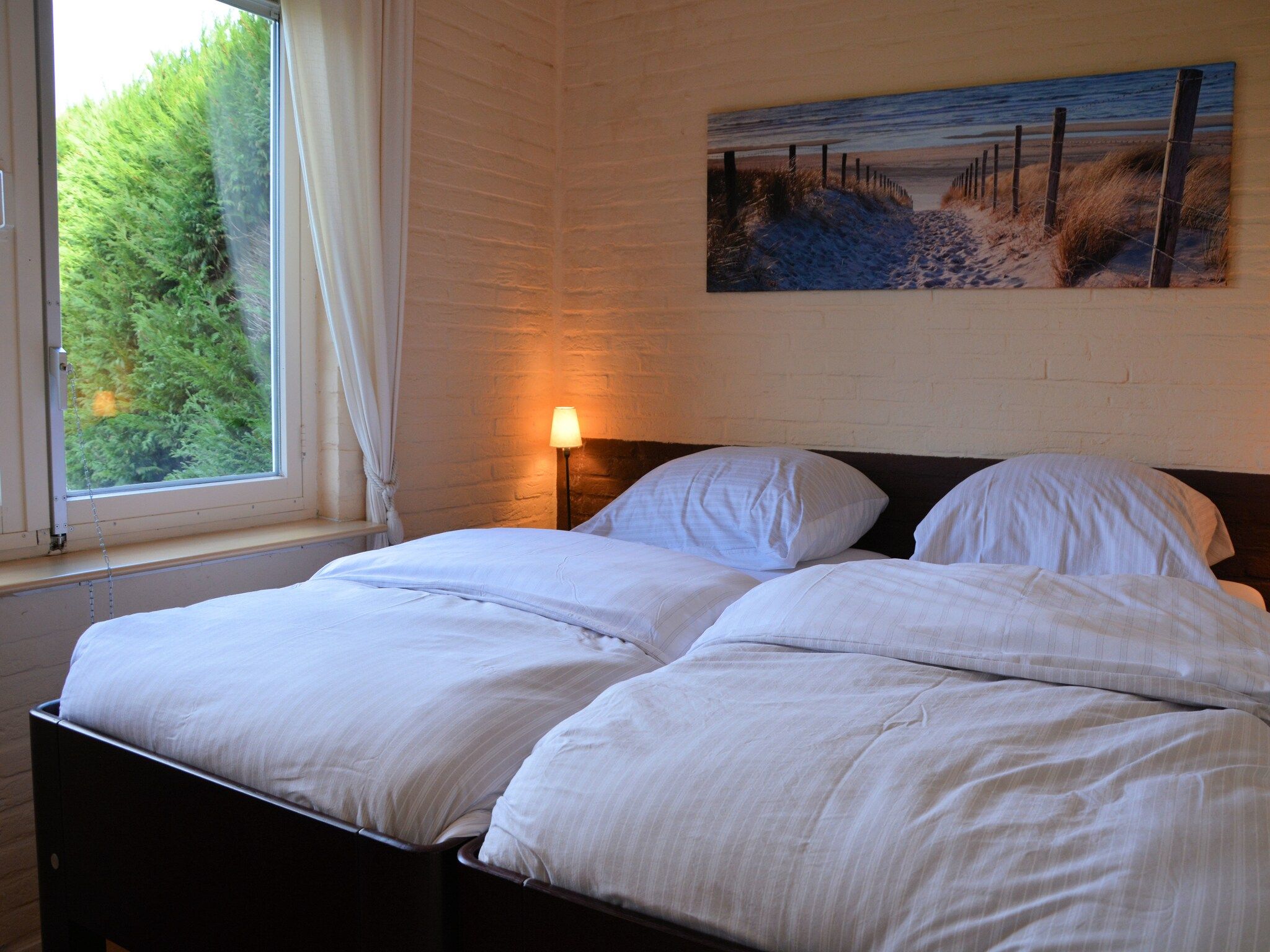 Een slaapkamer van Bos-Lodge in Noordwijkerhout