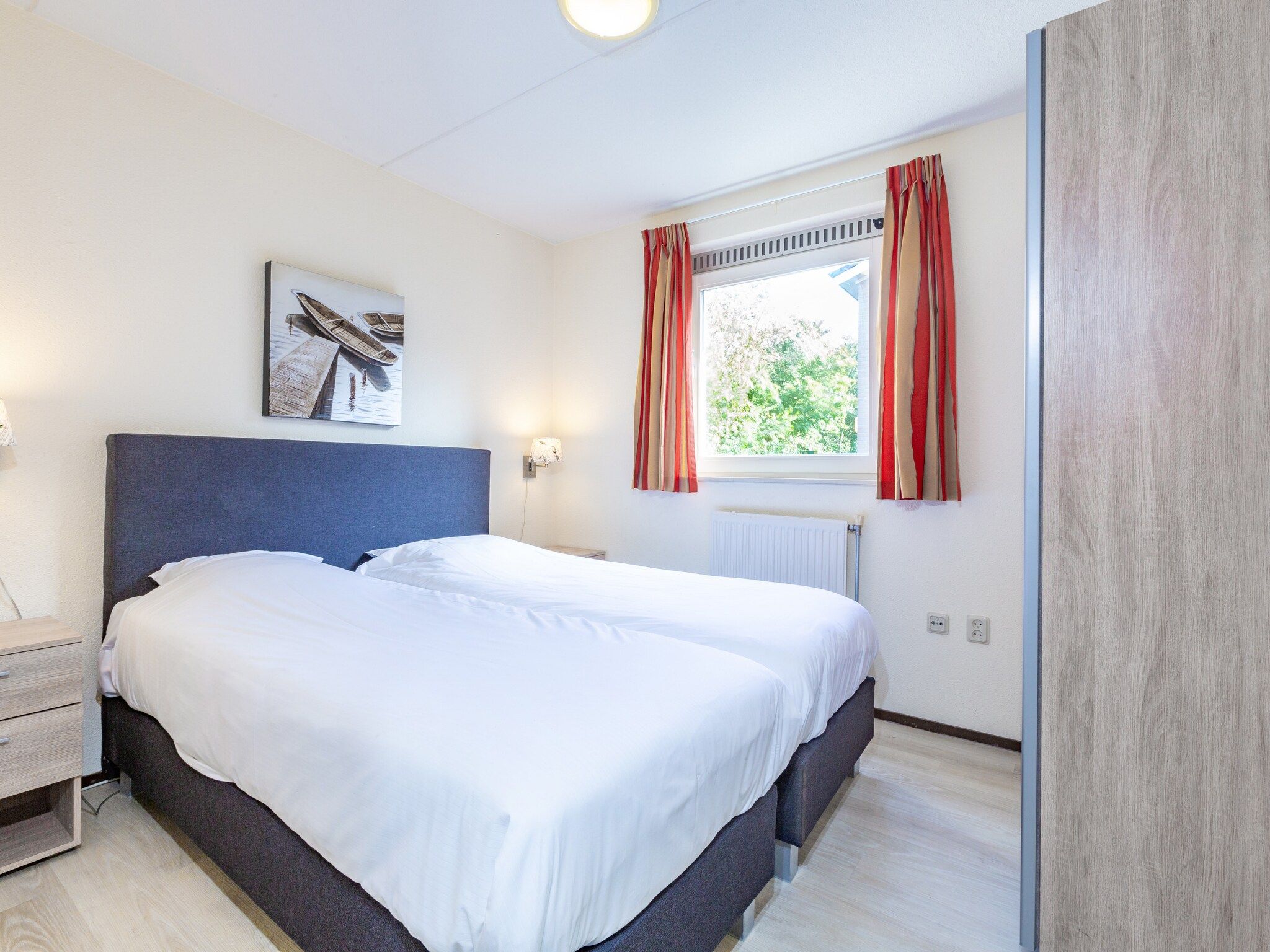 Een slaapkamer van Vakantiepark Kijkduin 7 in Den Haag