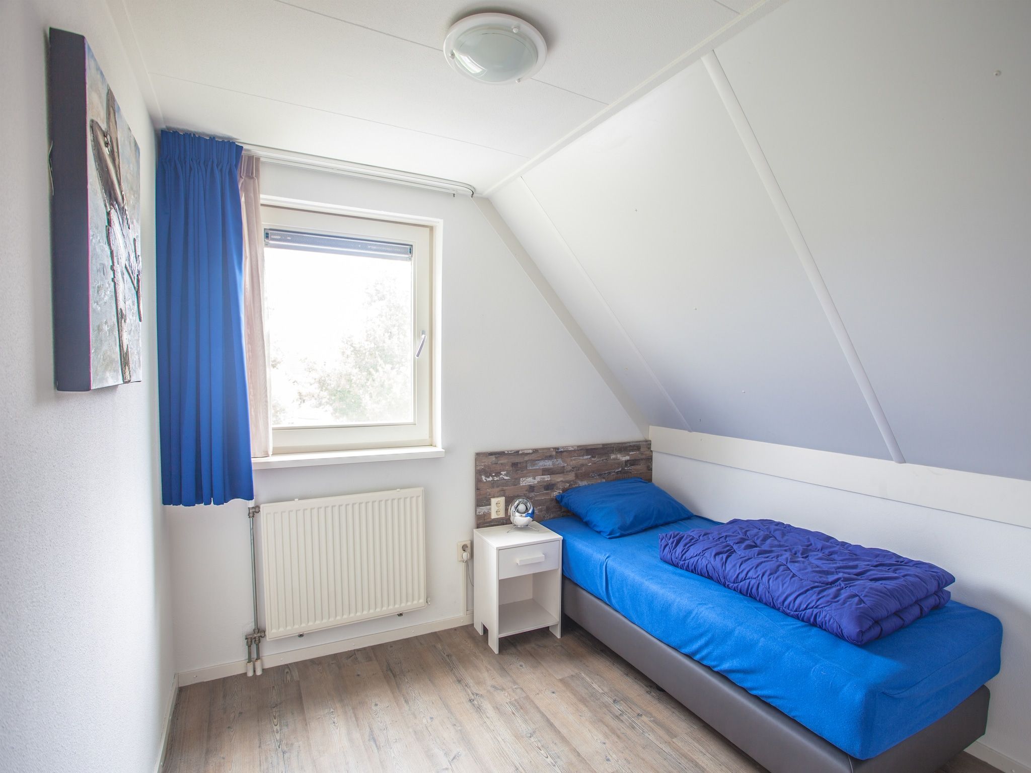 Een slaapkamer van Oosterdijk 6 in Medemblik