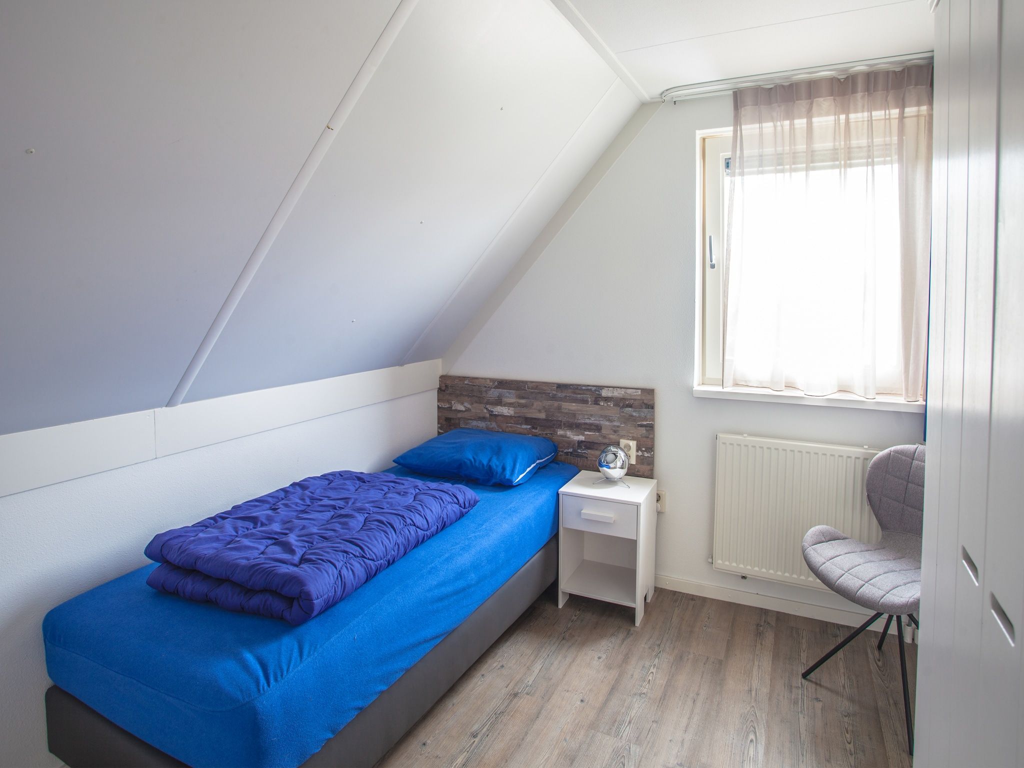 Een slaapkamer van Oosterdijk 6 in Medemblik