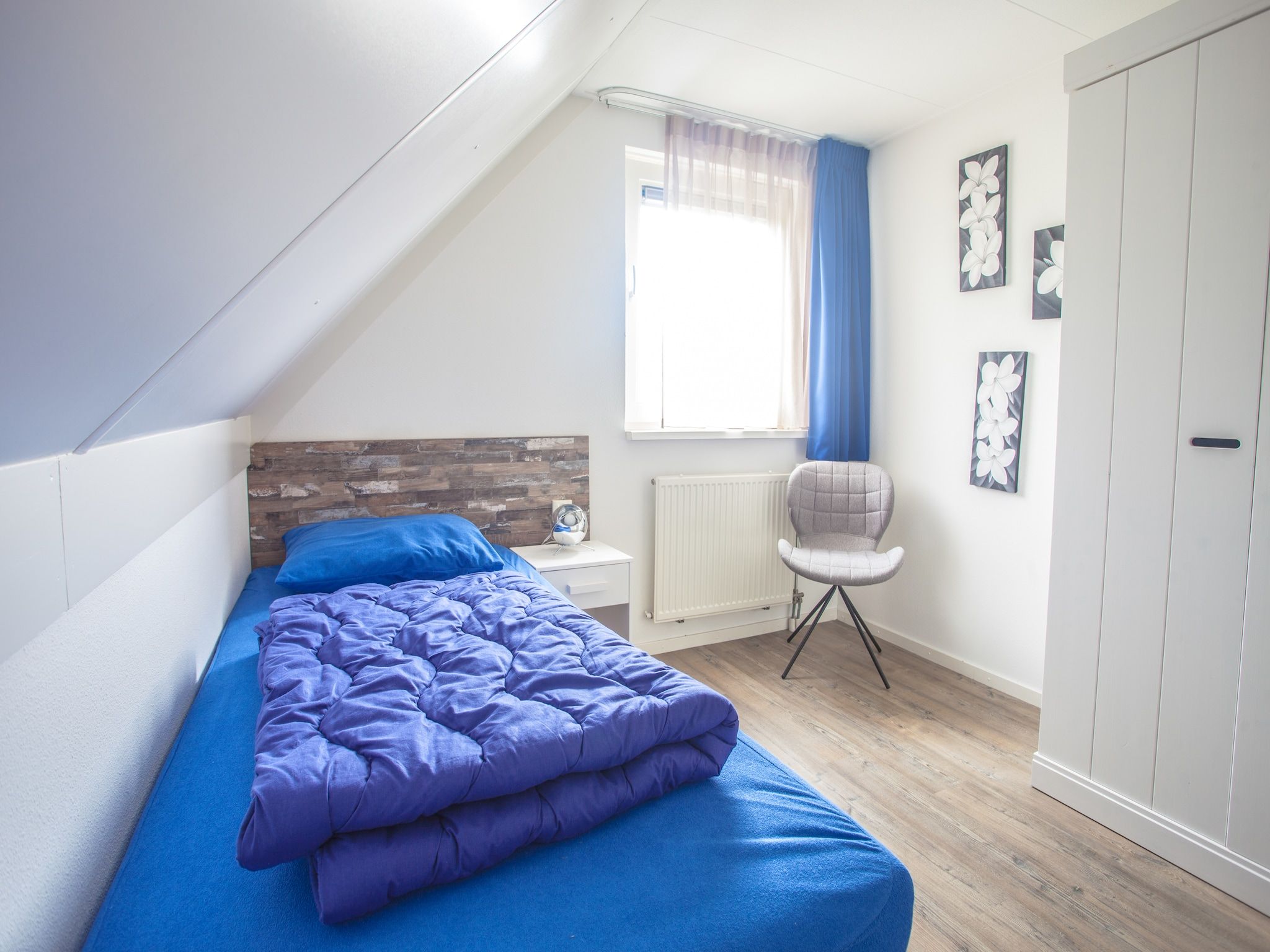 Een slaapkamer van Oosterdijk 6 in Medemblik