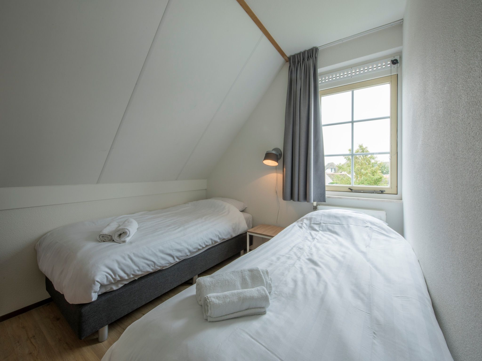 Een slaapkamer van Buitenhof Domburg 11 in Domburg