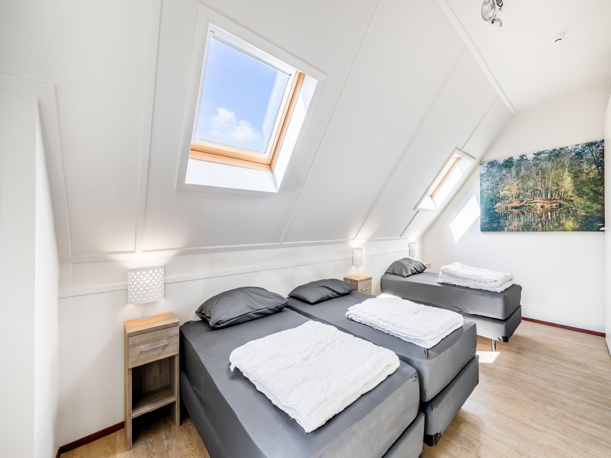 Een slaapkamer van Vakantiepark Weerterbergen 6 in Weert