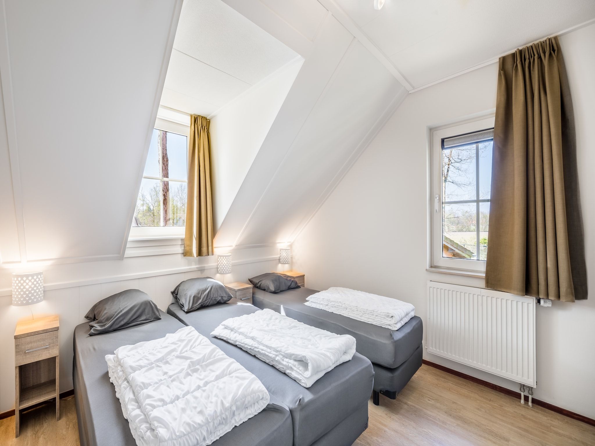 Een slaapkamer van Vakantiepark Weerterbergen 7 in Weert