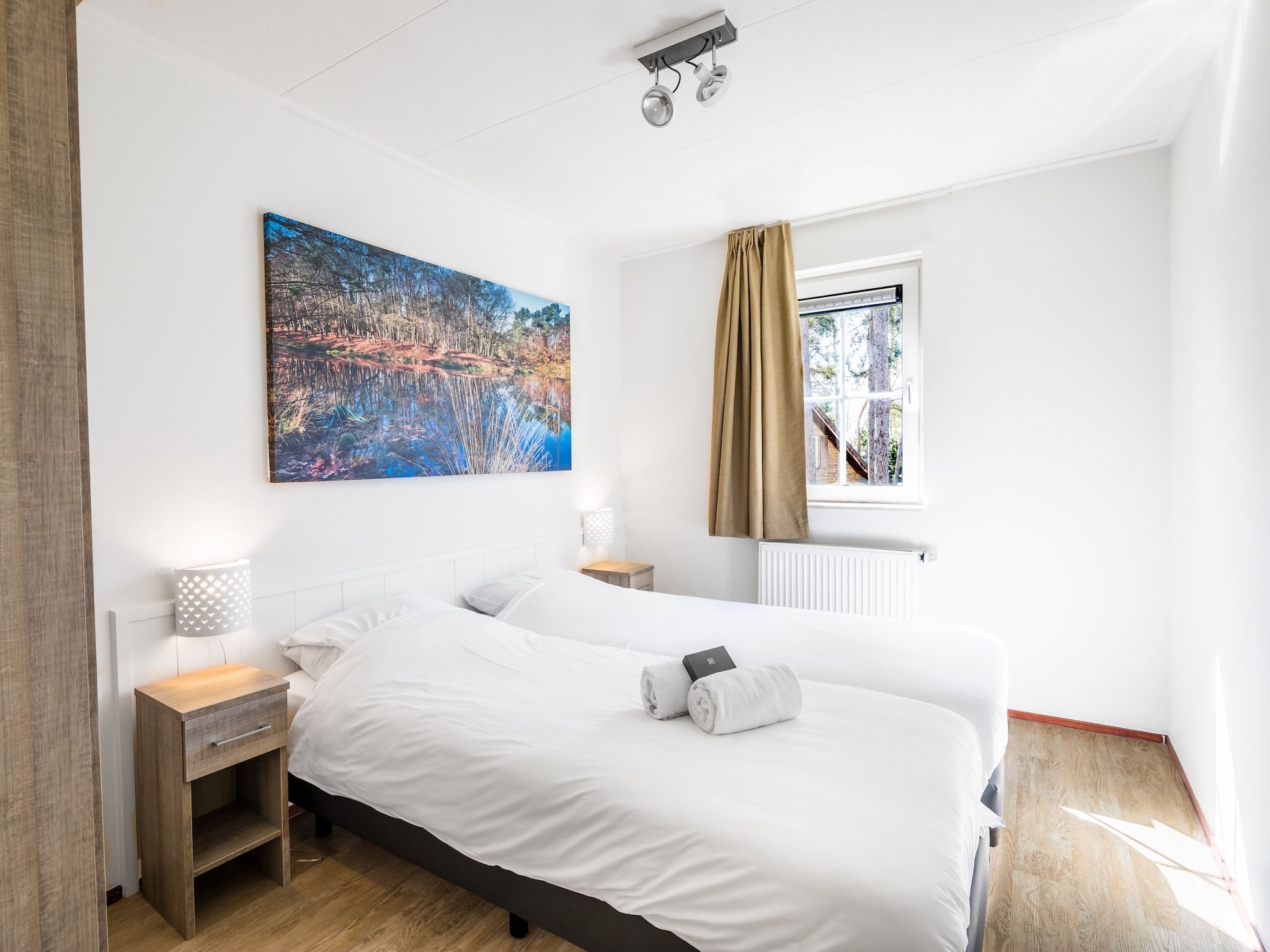 Een slaapkamer van Vakantiepark Weerterbergen 7 in Weert