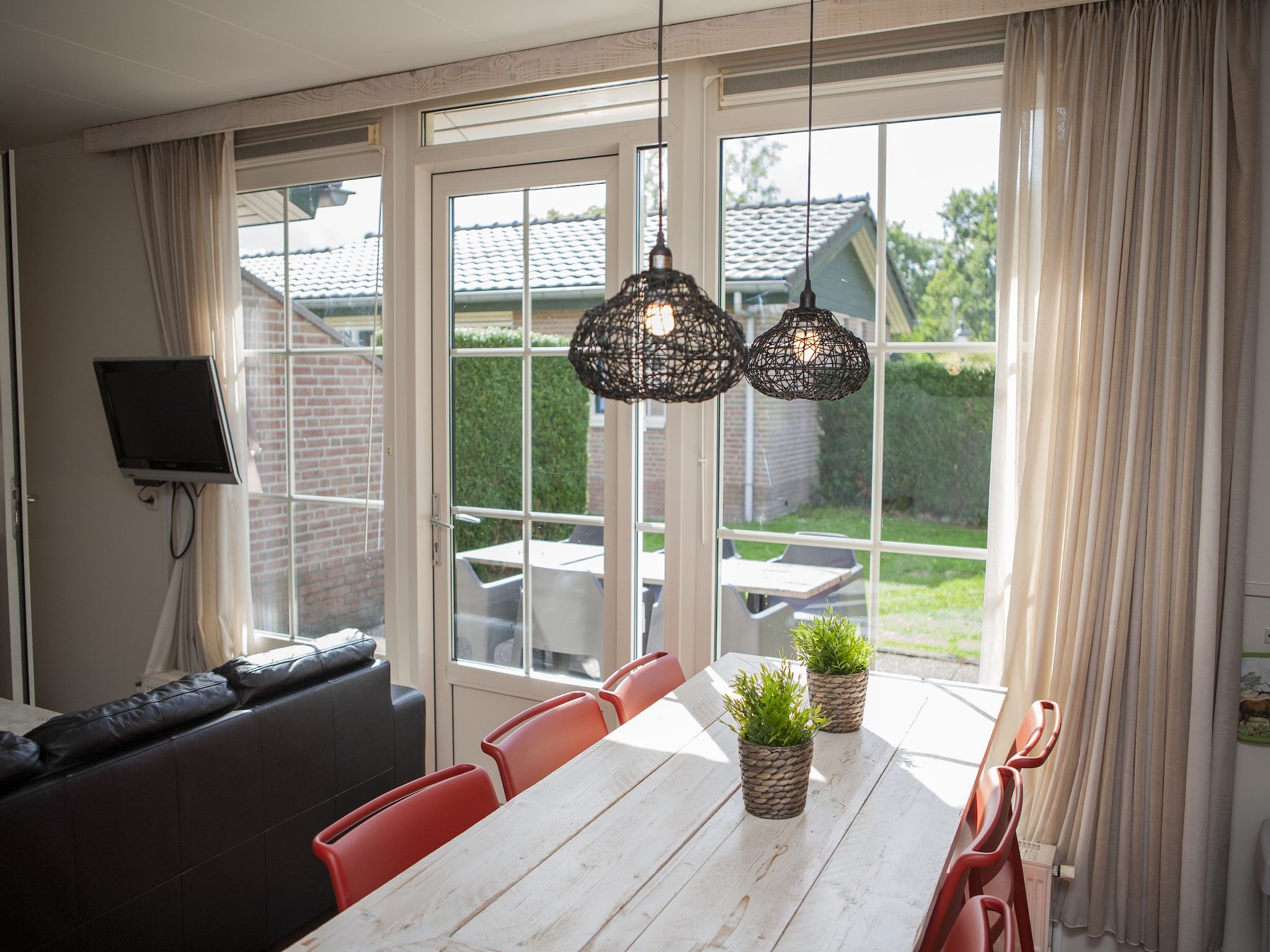 De woonkamer van Recreatiepark de Boshoek 13 in Voorthuizen