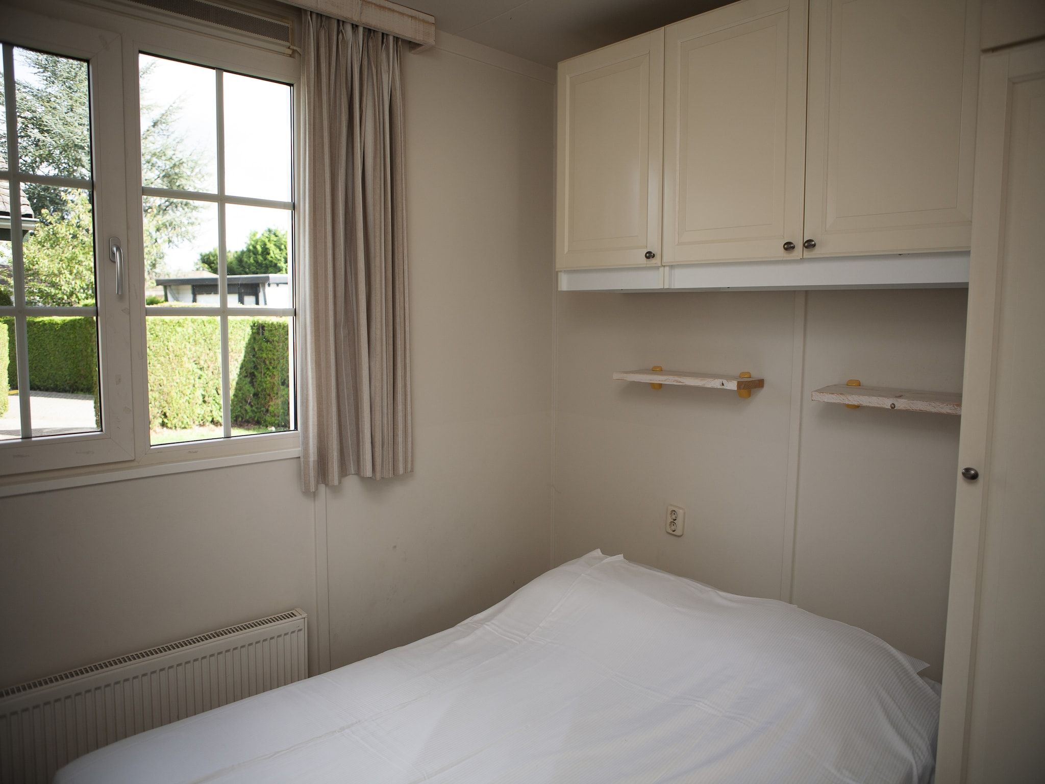 Een slaapkamer van Recreatiepark de Boshoek 13 in Voorthuizen