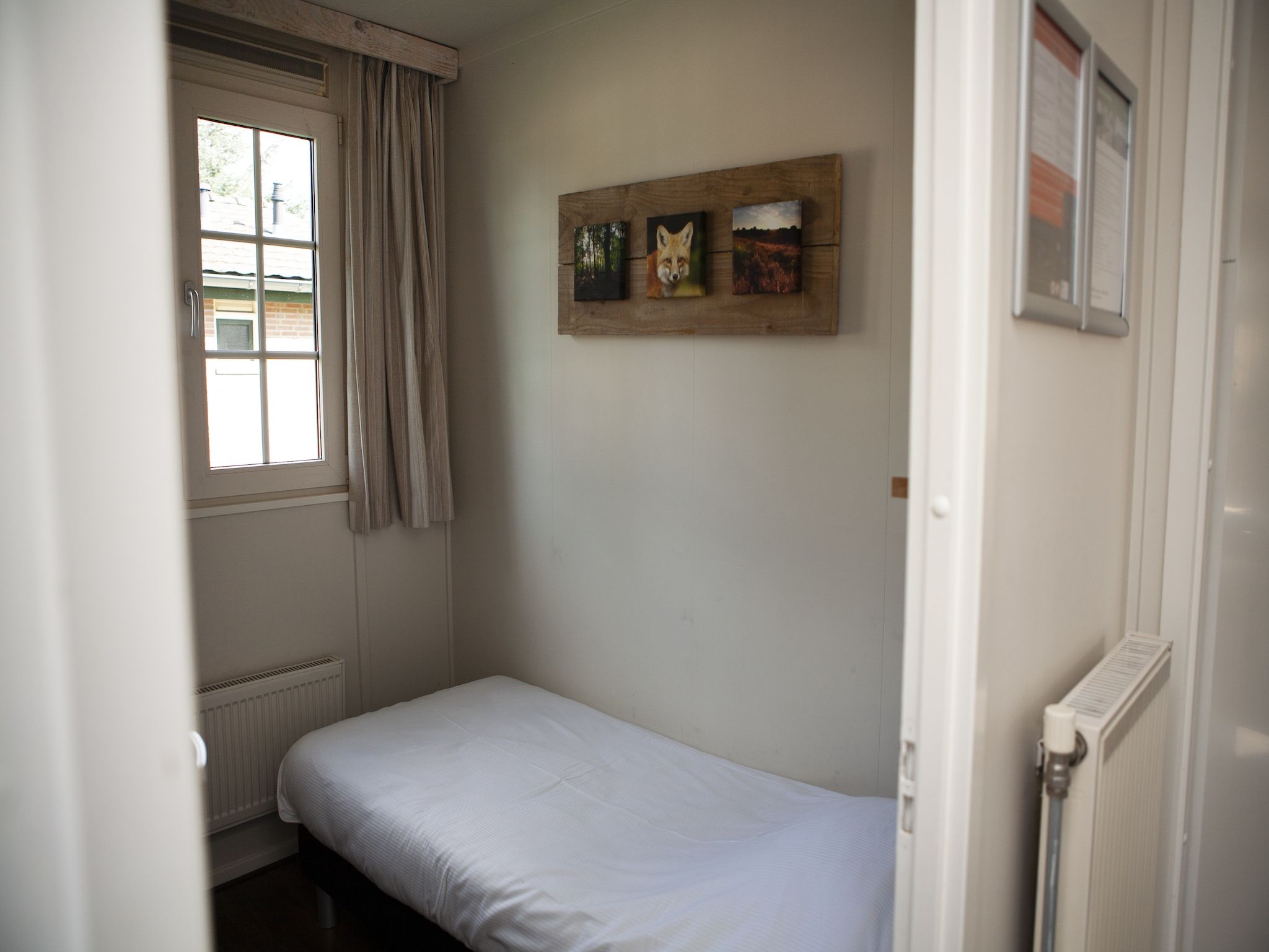 Een slaapkamer van Recreatiepark de Boshoek 13 in Voorthuizen