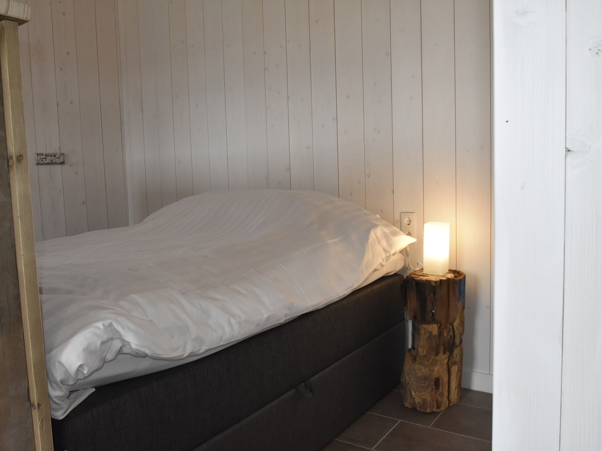 Een slaapkamer van Hazenborgh - Studio Eb in Callantsoog