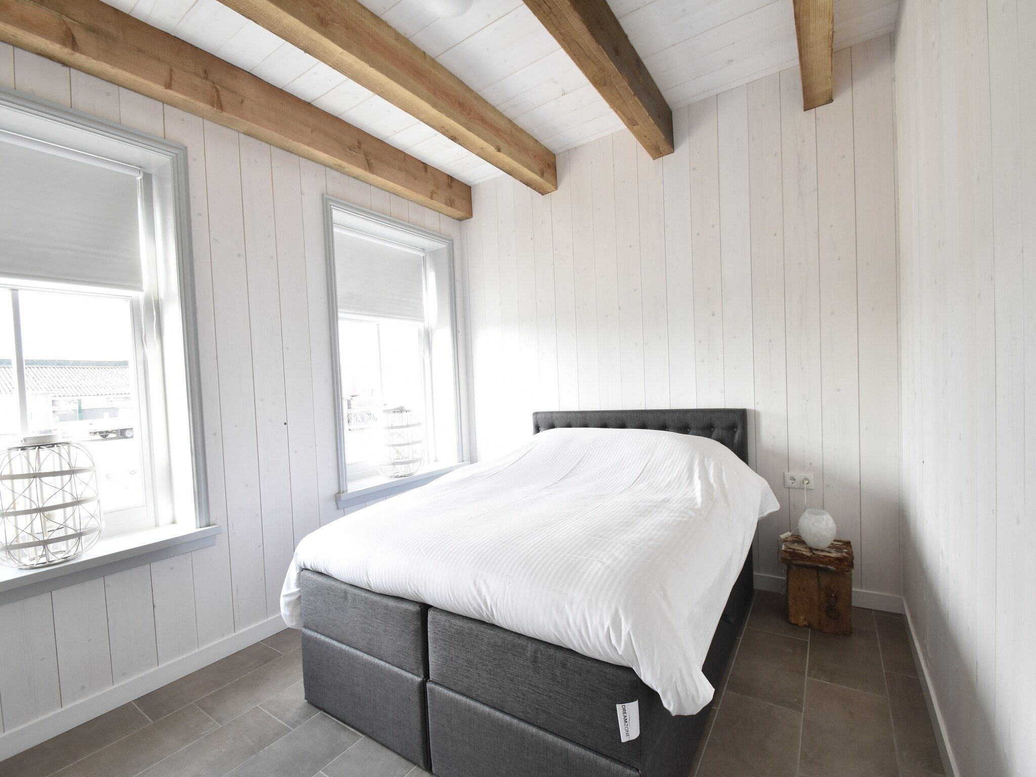 Een slaapkamer van Hazenborgh - Strandhuys in Callantsoog