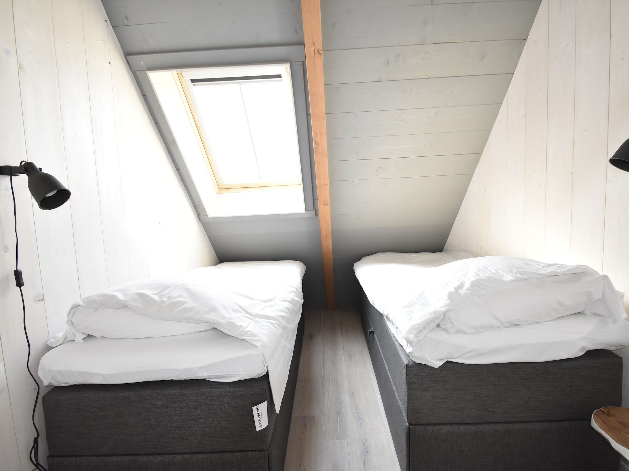 Een slaapkamer van Hazenborgh - Strandhuys in Callantsoog