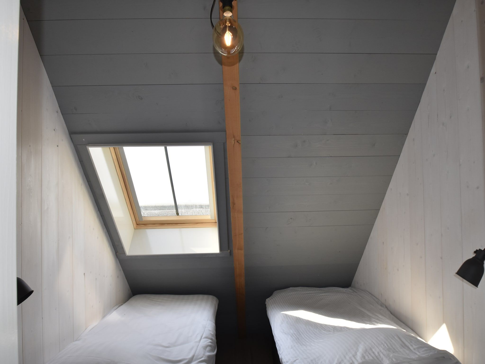 Een slaapkamer van Hazenborgh - Strandhuys in Callantsoog