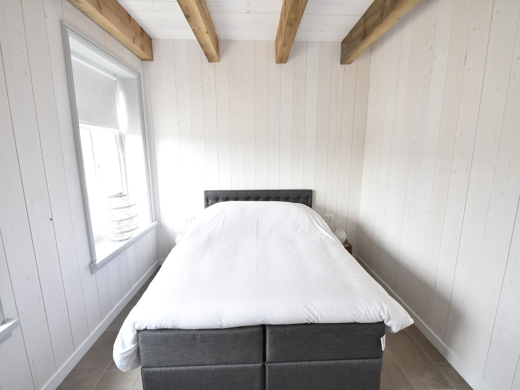 Een slaapkamer van Hazenborgh - Strandhuys in Callantsoog