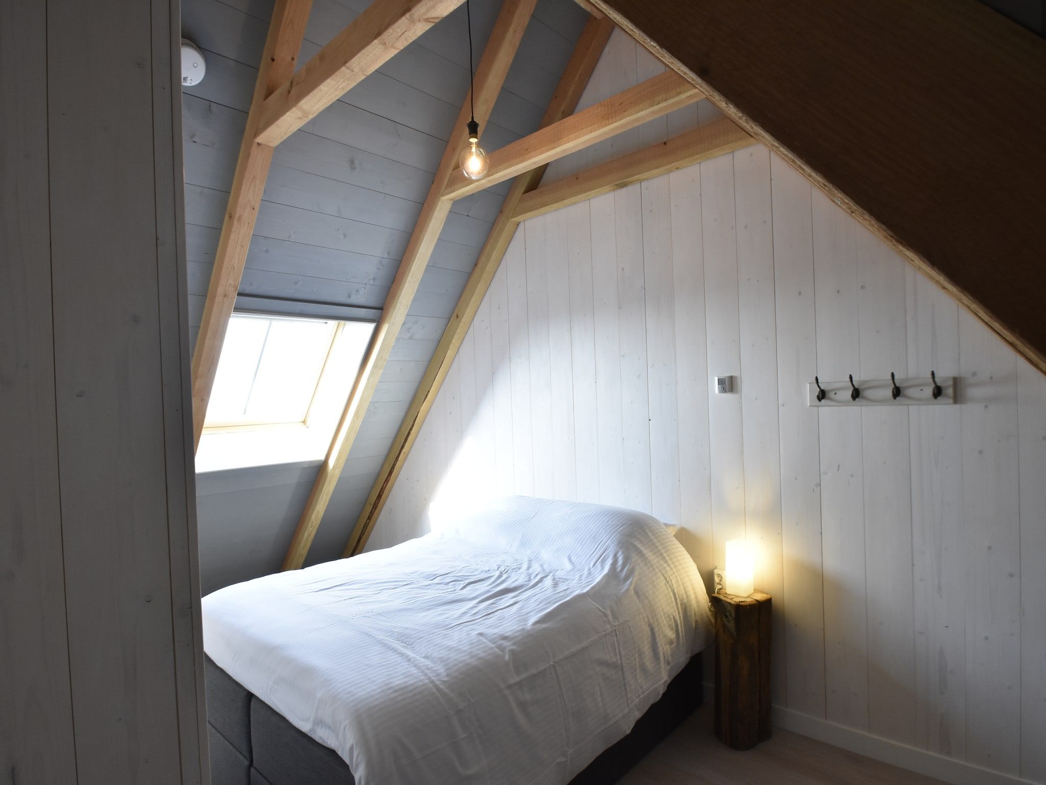 Een slaapkamer van Hazenborgh - Strandhuys in Callantsoog