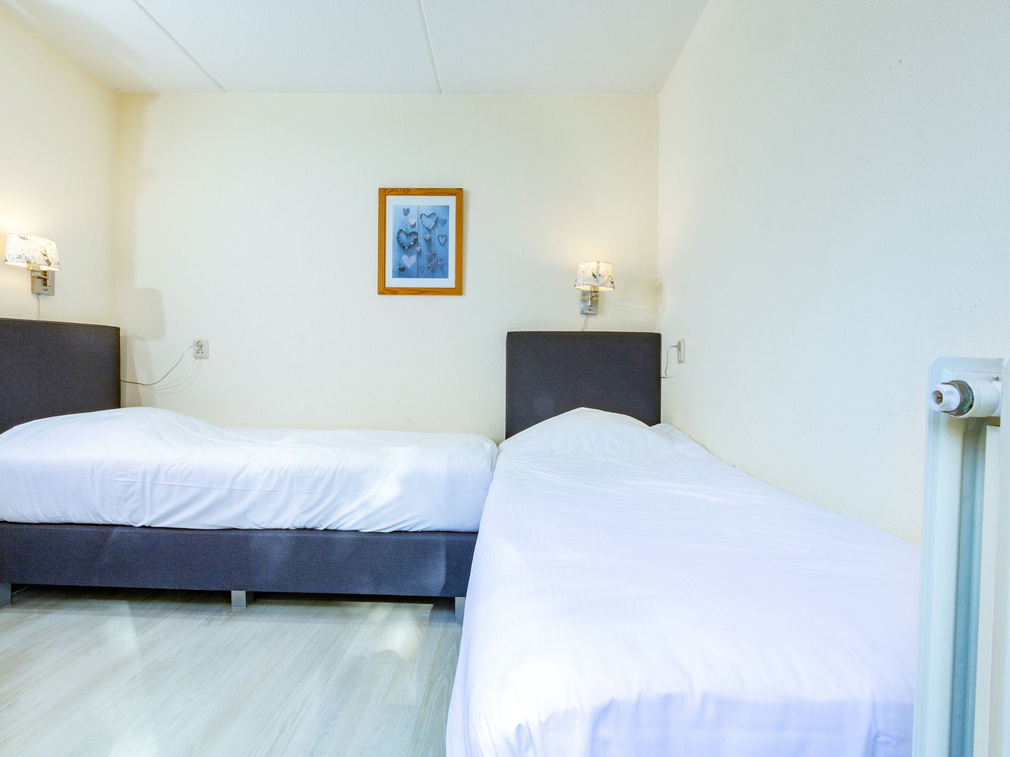 Een slaapkamer van Vakantiepark Kijkduin 8 in Den Haag