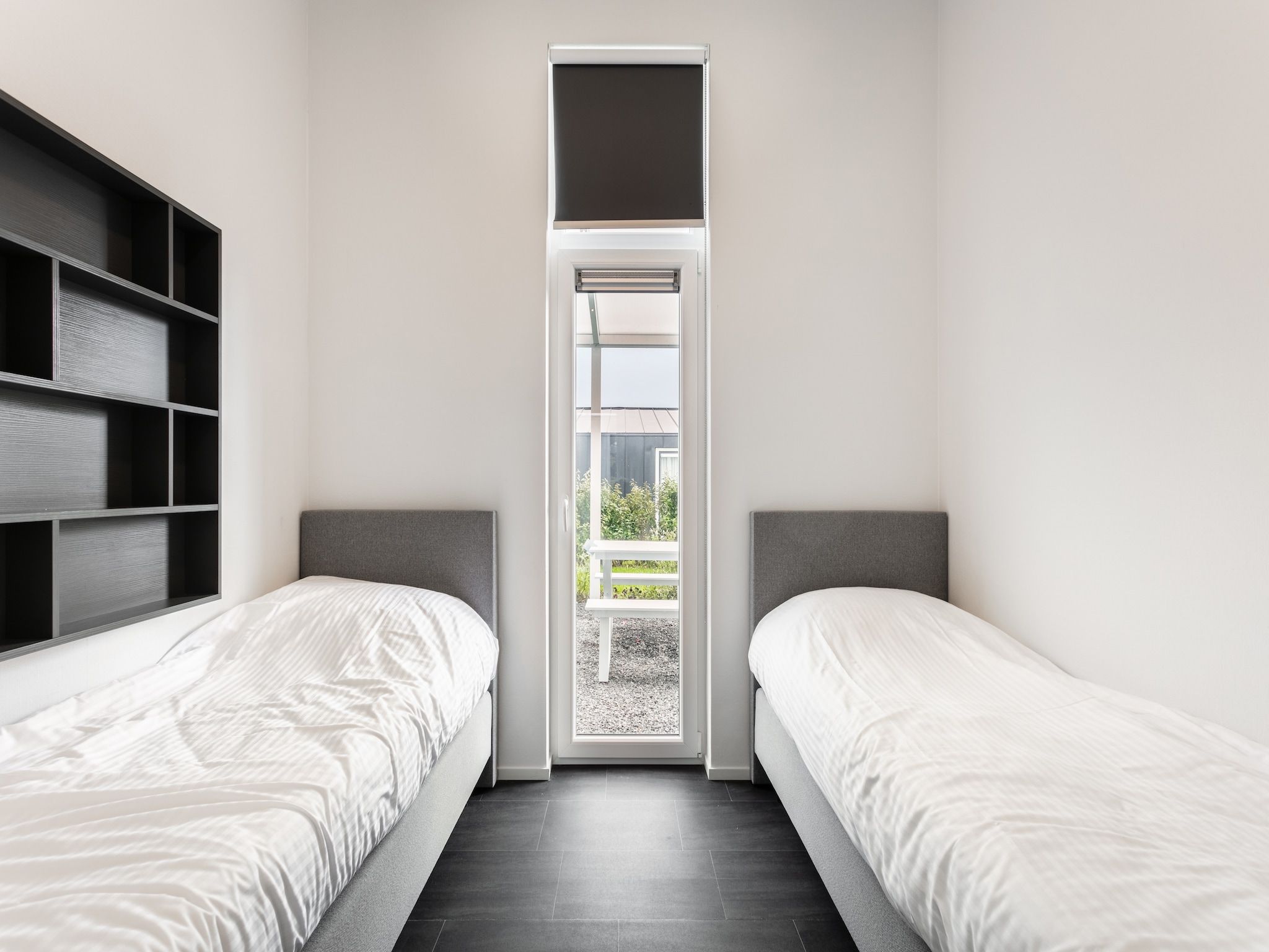 Een slaapkamer van Water Resort Oosterschelde 70 in Wemeldinge