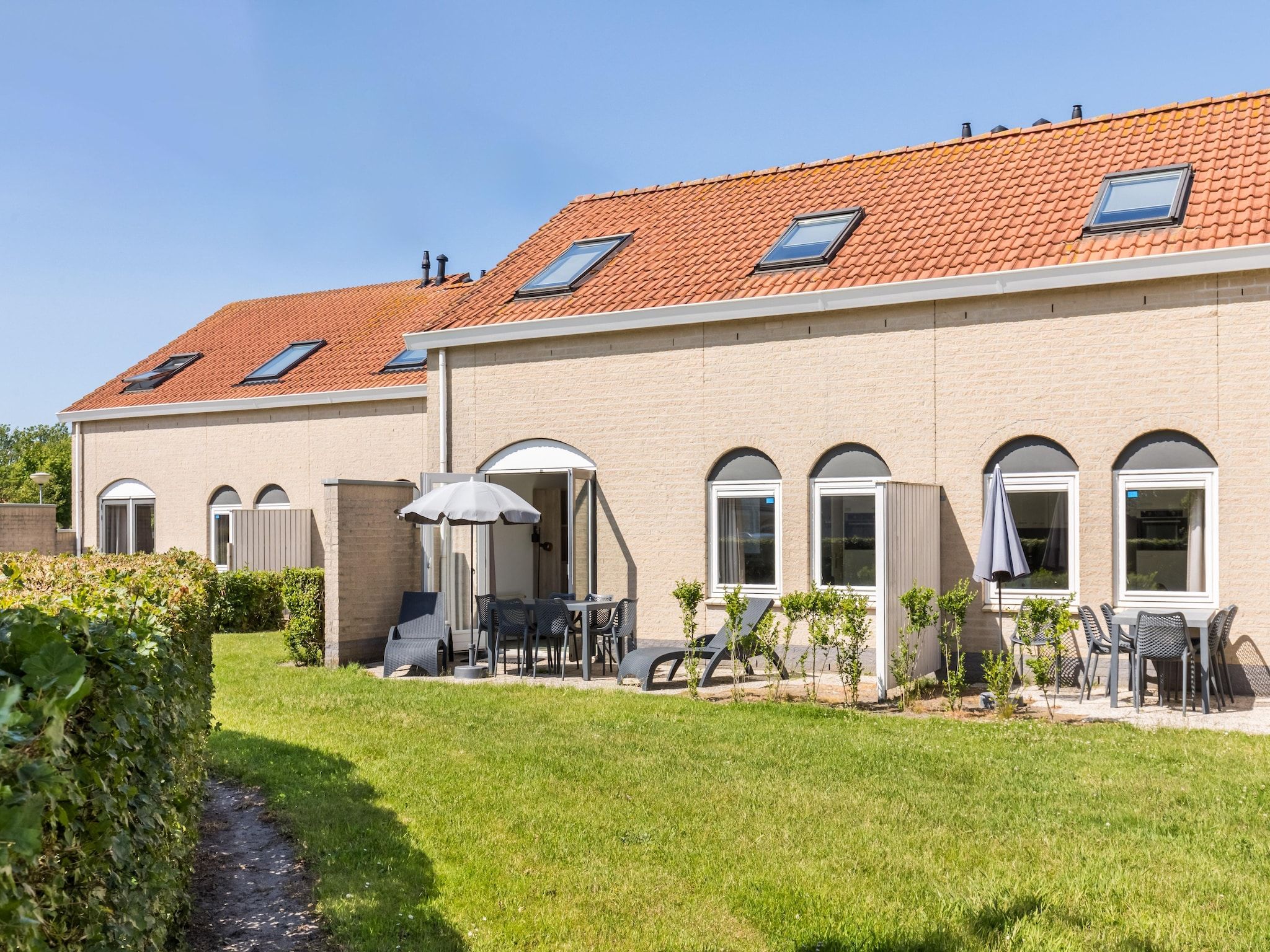 De tuin van Vakantiepark Soeten Haert 13 in Renesse