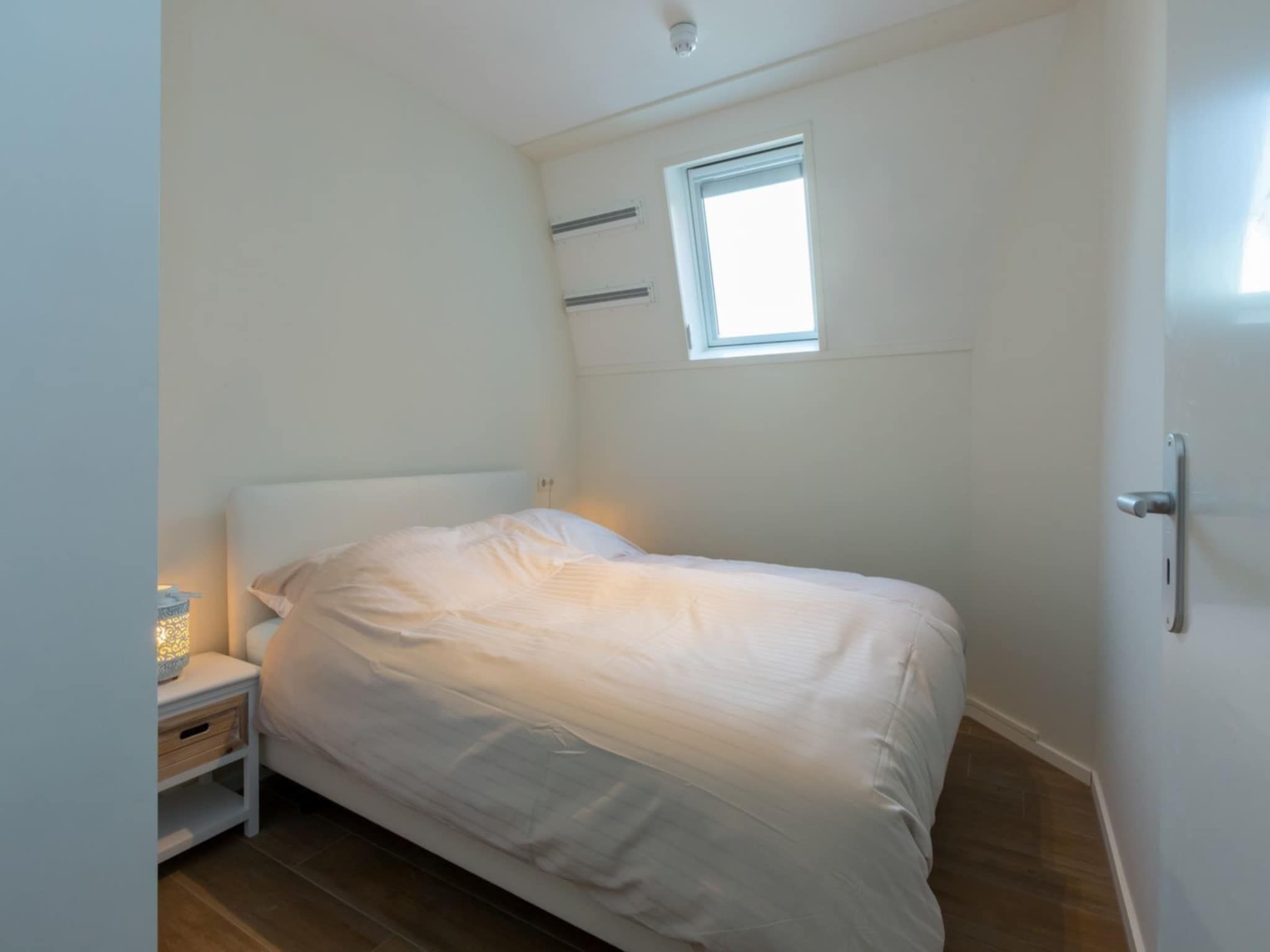 Een slaapkamer van Appartement Duinhof Dishoek 13N - 6 personen in Koudekerke