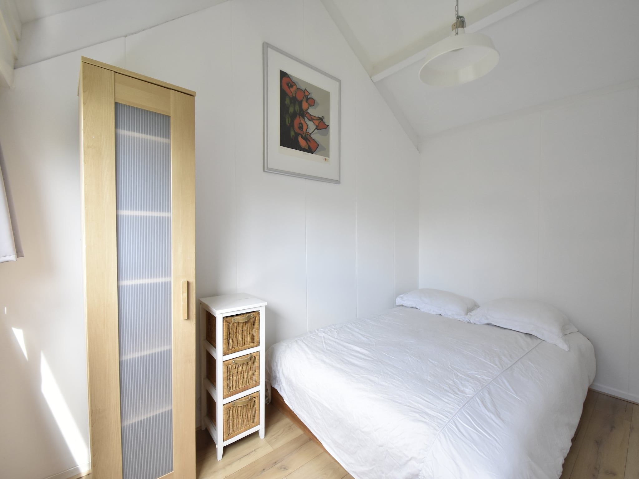 Een slaapkamer van De Reker Zon in Warmenhuizen