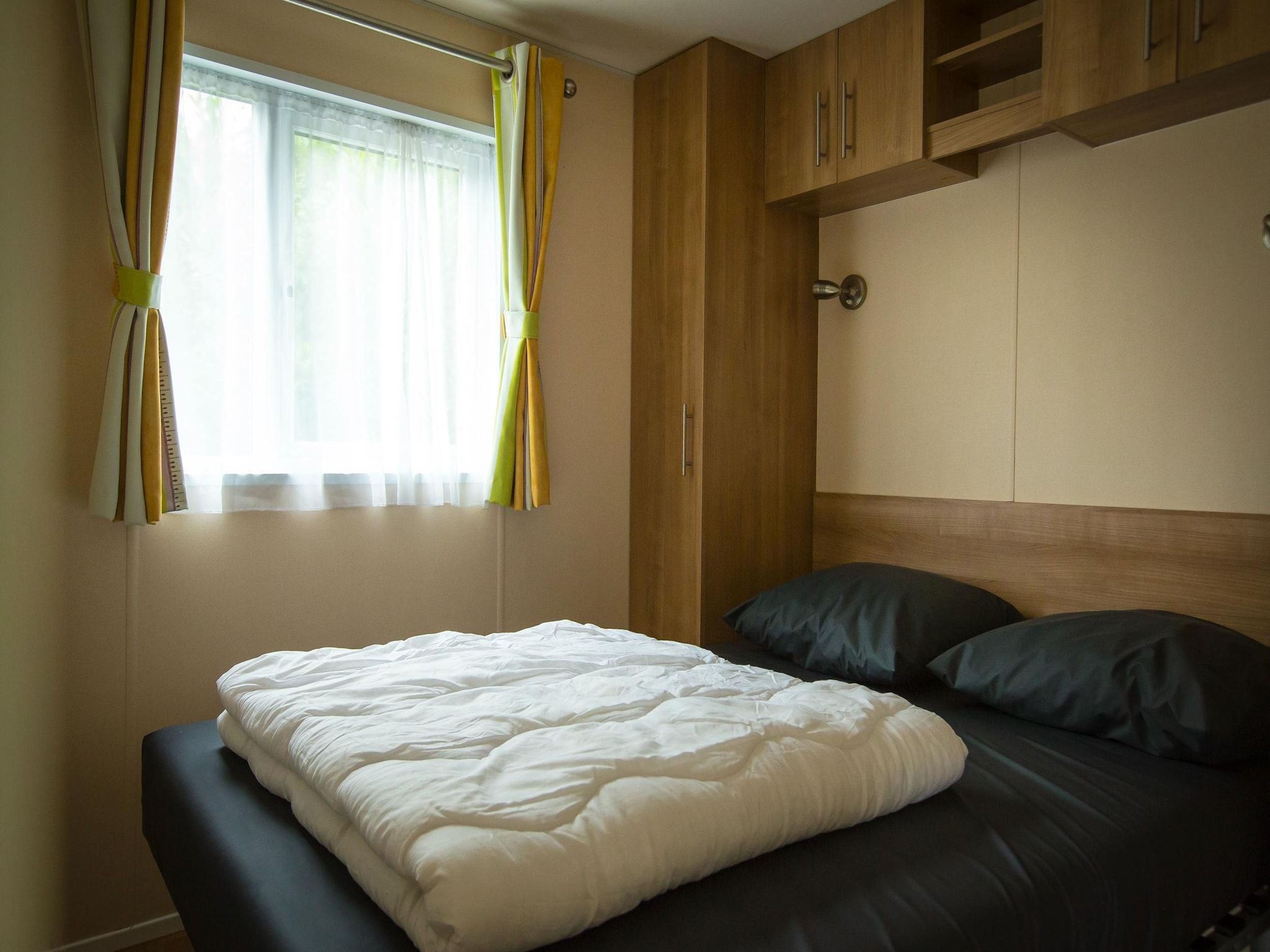 Een slaapkamer van Recreatiepark Duinhoeve 4 in Udenhout