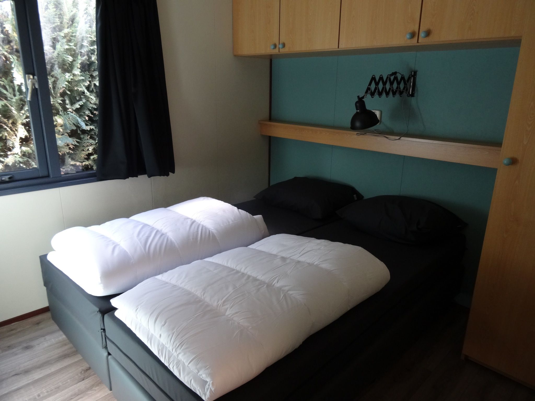 Een slaapkamer van Recreatiepark Duinhoeve 5 in Udenhout