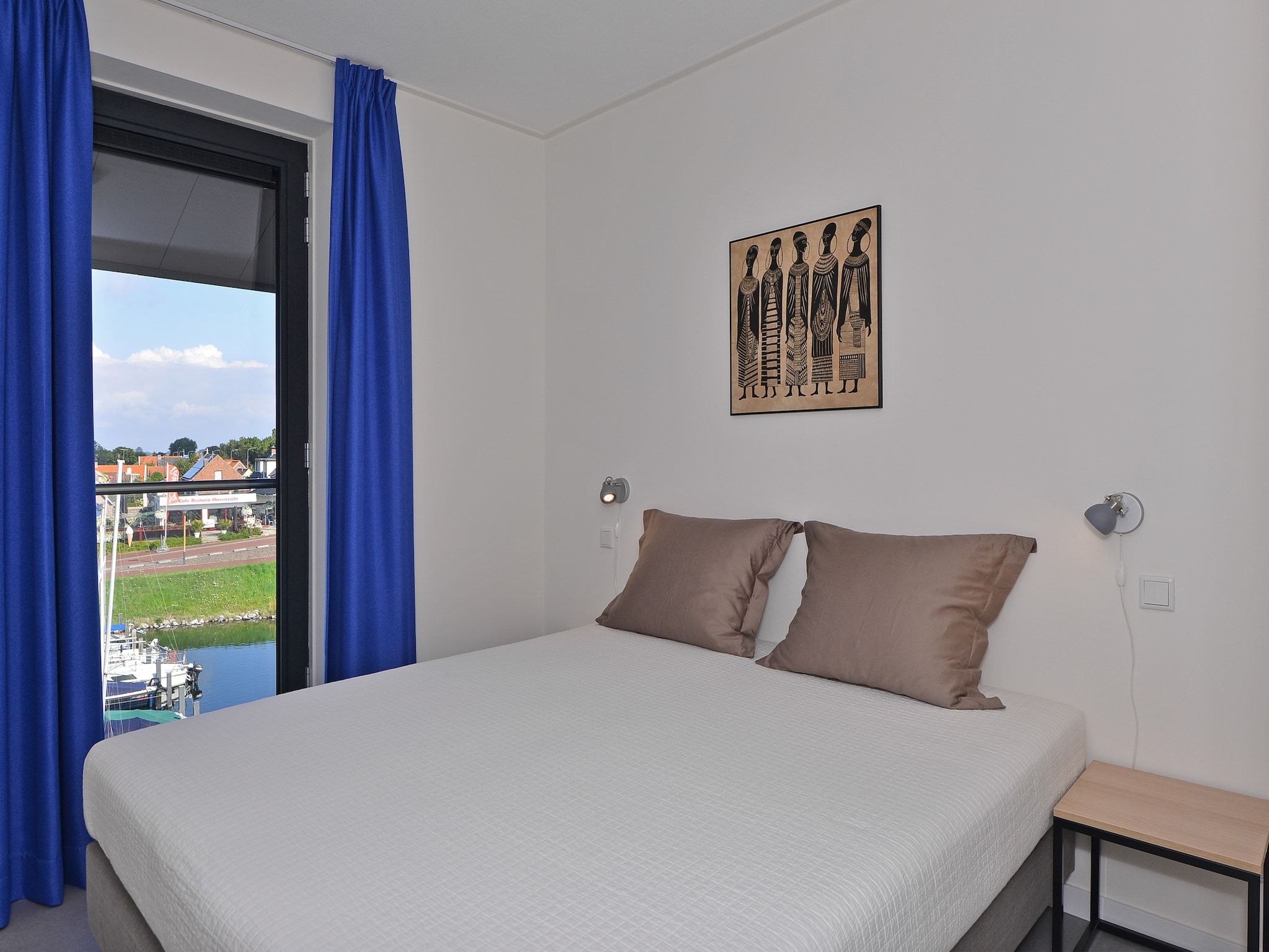 Een slaapkamer van Uithaven 10 F in Kamperland