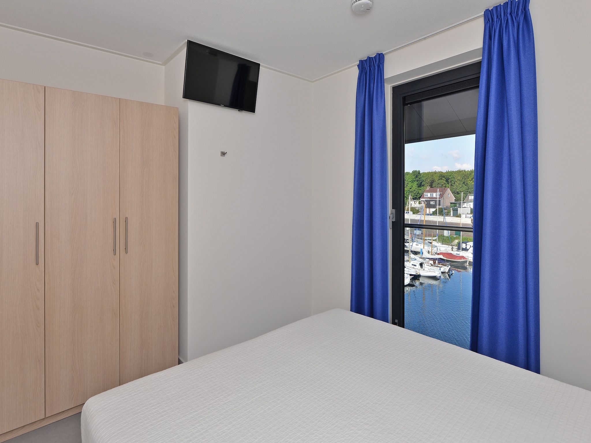 Een slaapkamer van Uithaven 10 F in Kamperland