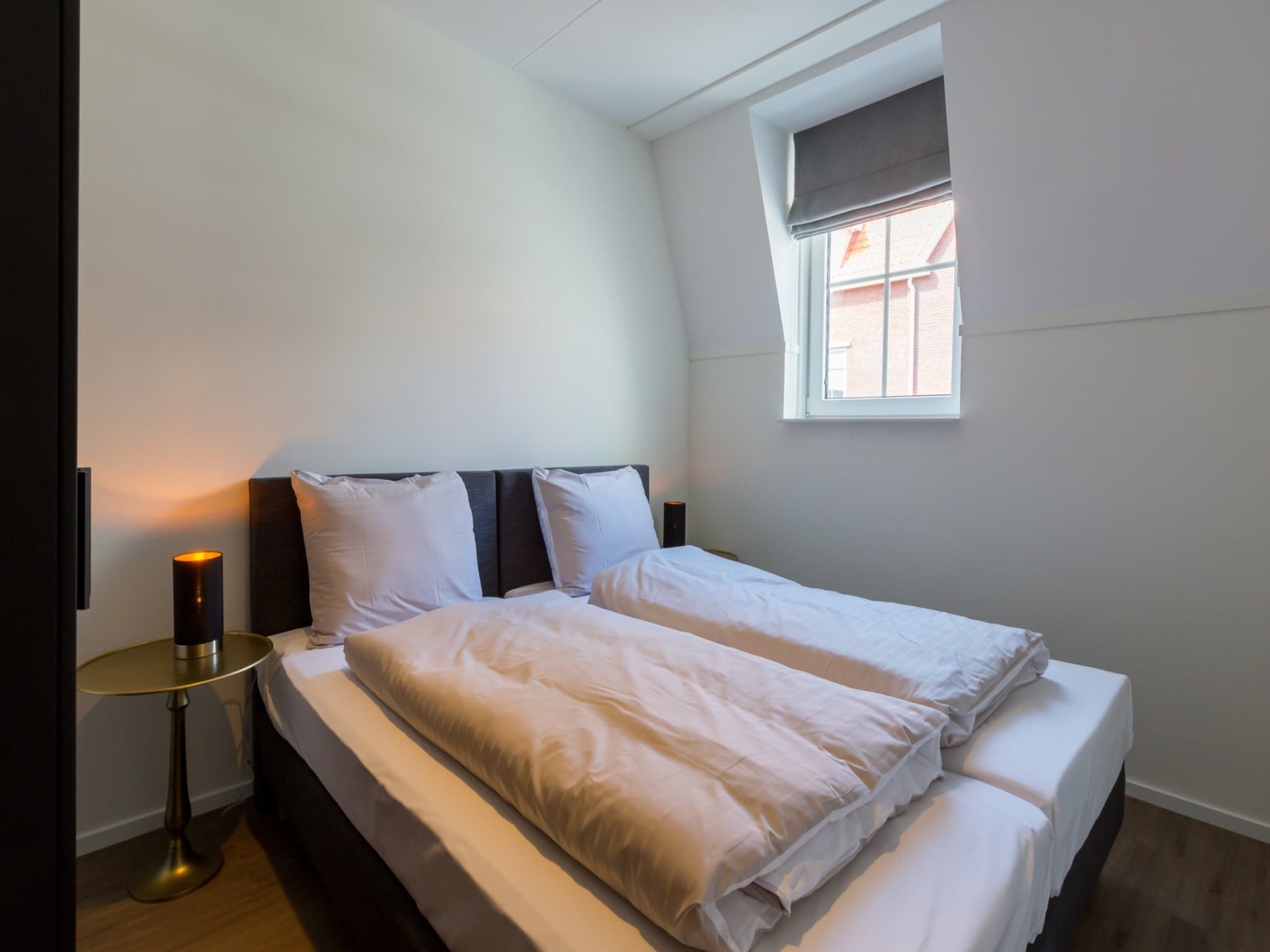 Een slaapkamer van Appartement Duinhof Dishoek 13F - 6 personen sauna in Koudekerke