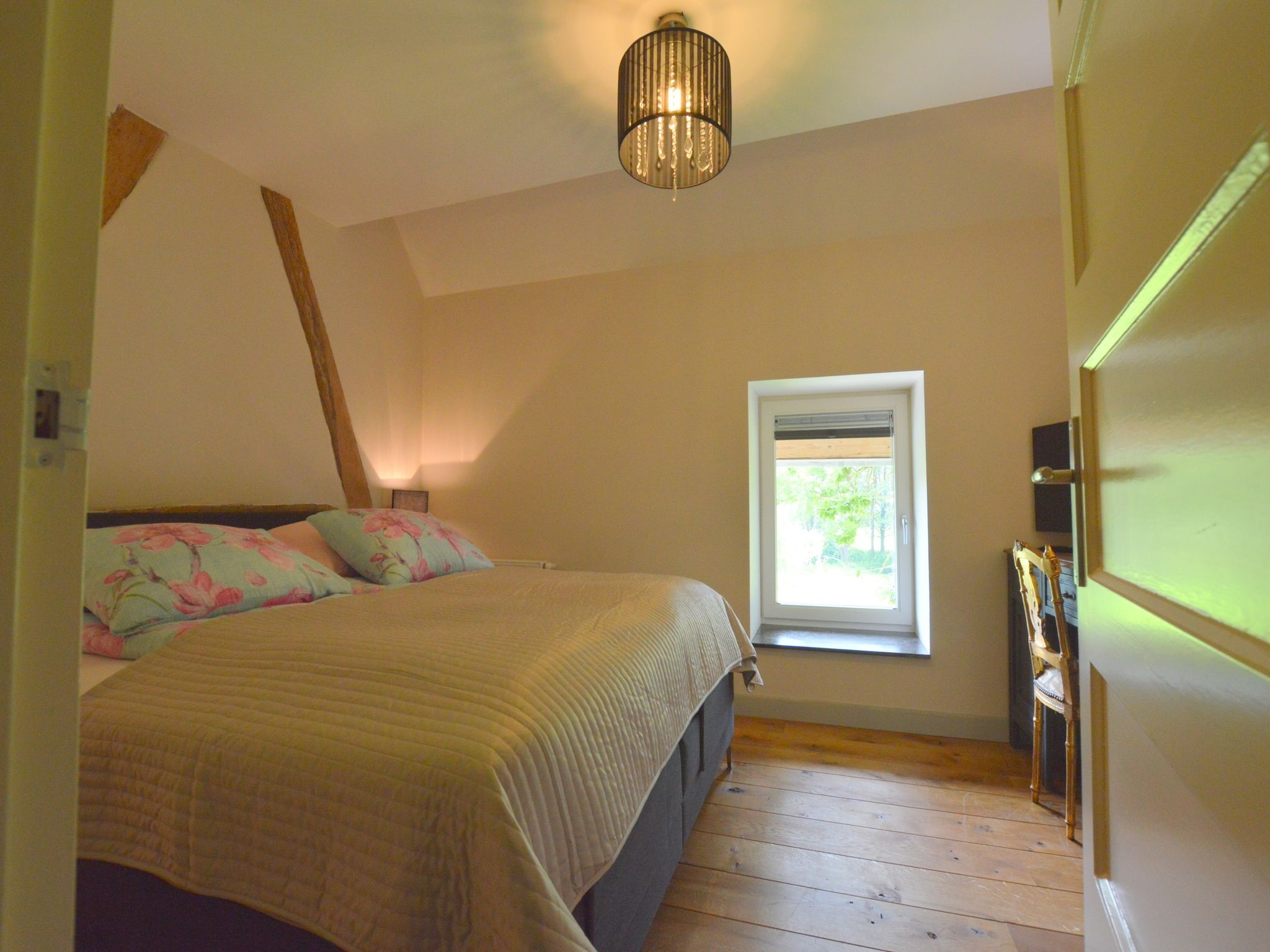 Een slaapkamer van Hoeve A Gen Water- Donderblumke in Slenaken