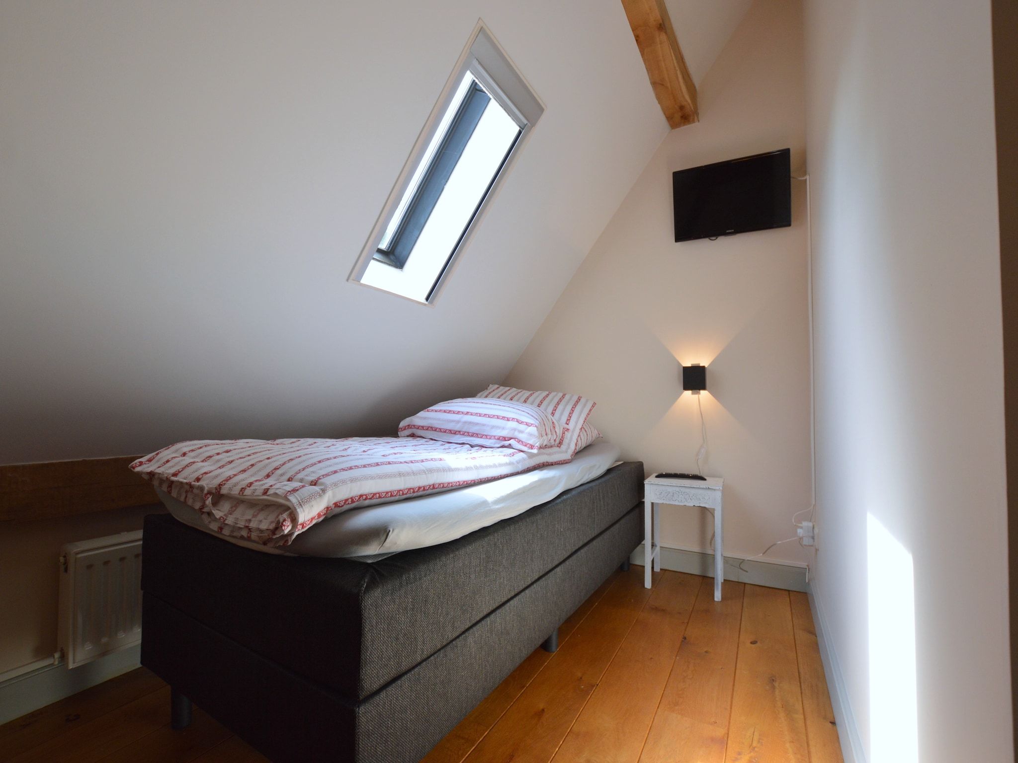 Een slaapkamer van Hoeve A Gen Water- Donderblumke in Slenaken