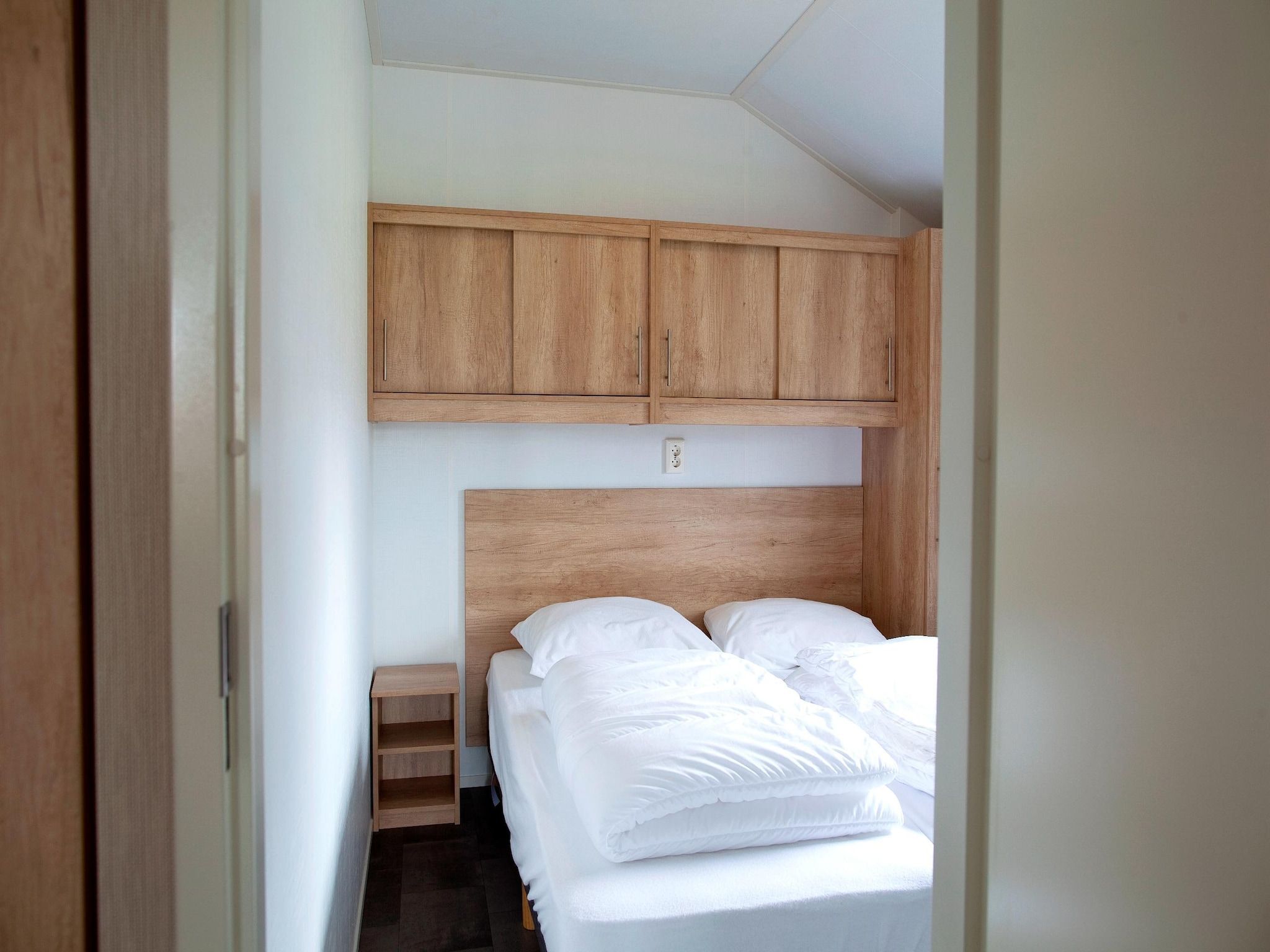 Een slaapkamer van Vakantiepark Eigen Wijze 8 in Bant