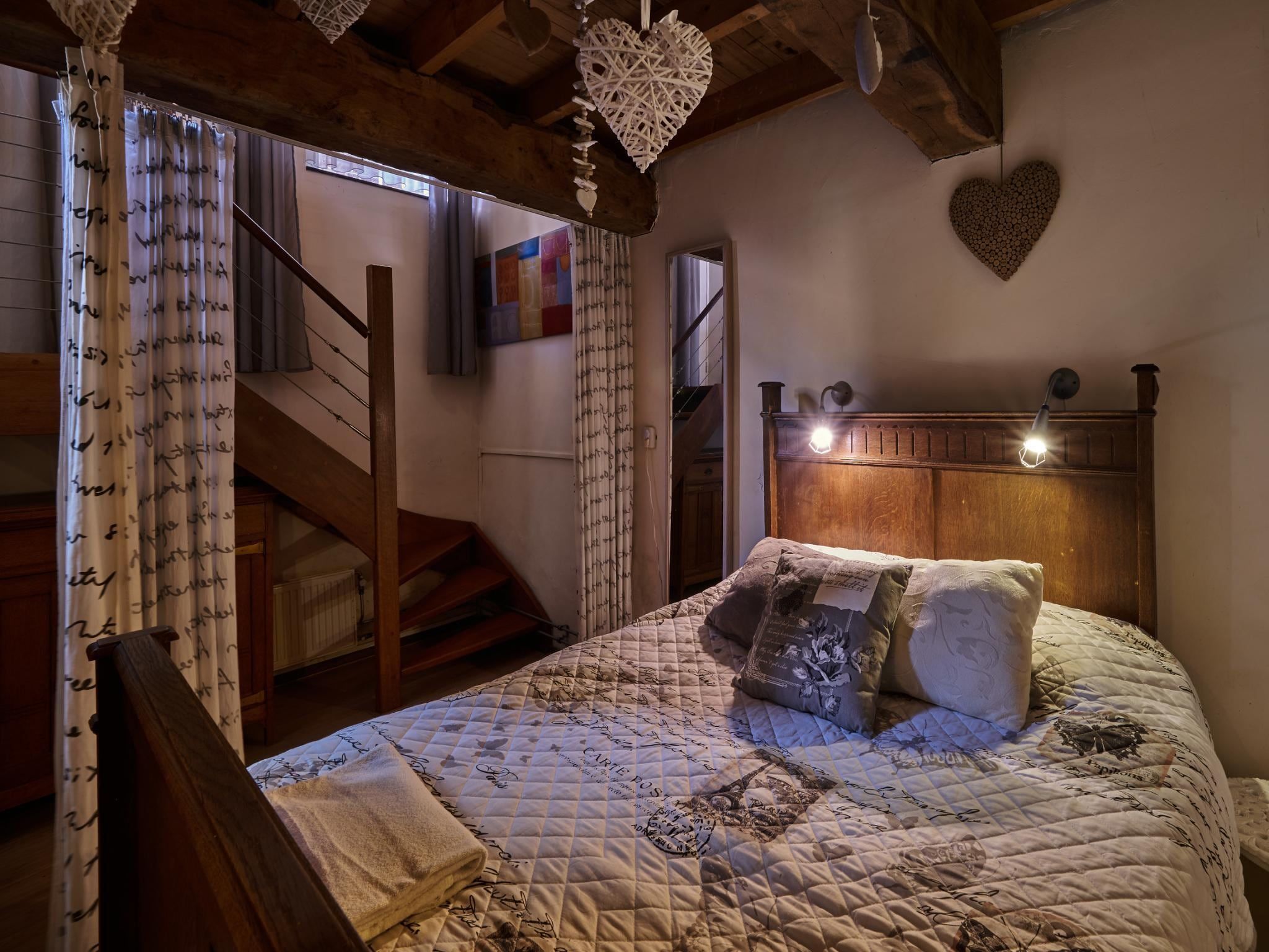 Een slaapkamer van Meschermolen 1 in Mesch-Eijsden