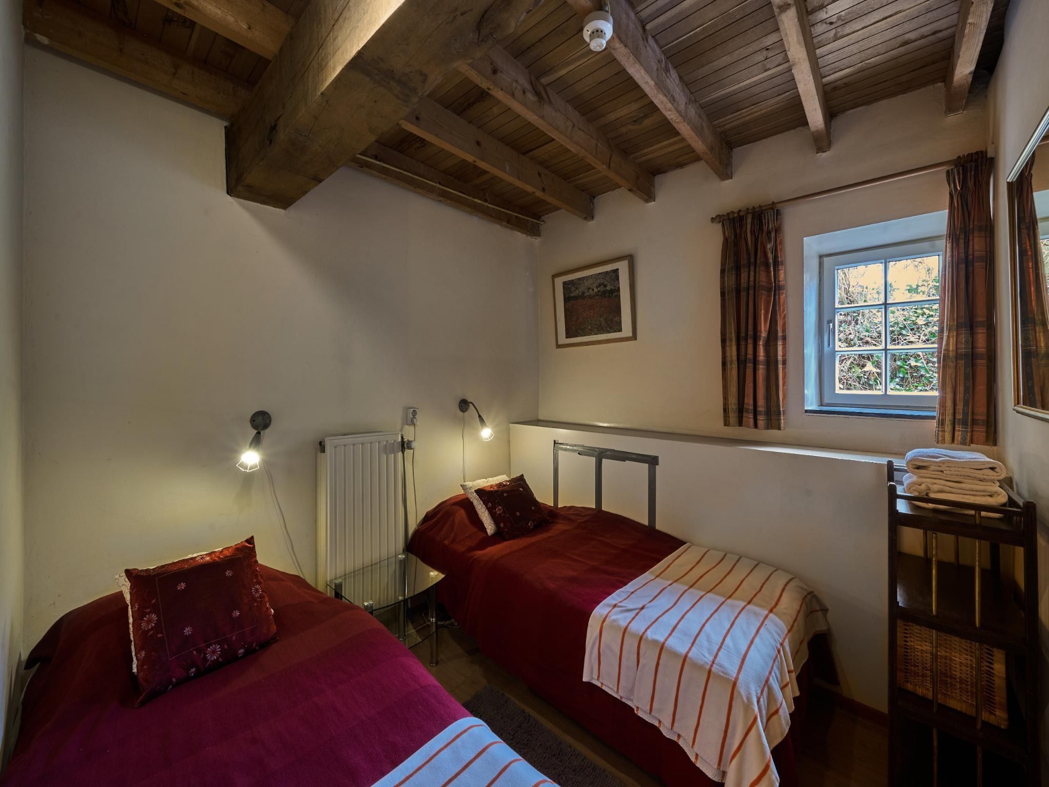 Een slaapkamer van Meschermolen 1 in Mesch-Eijsden