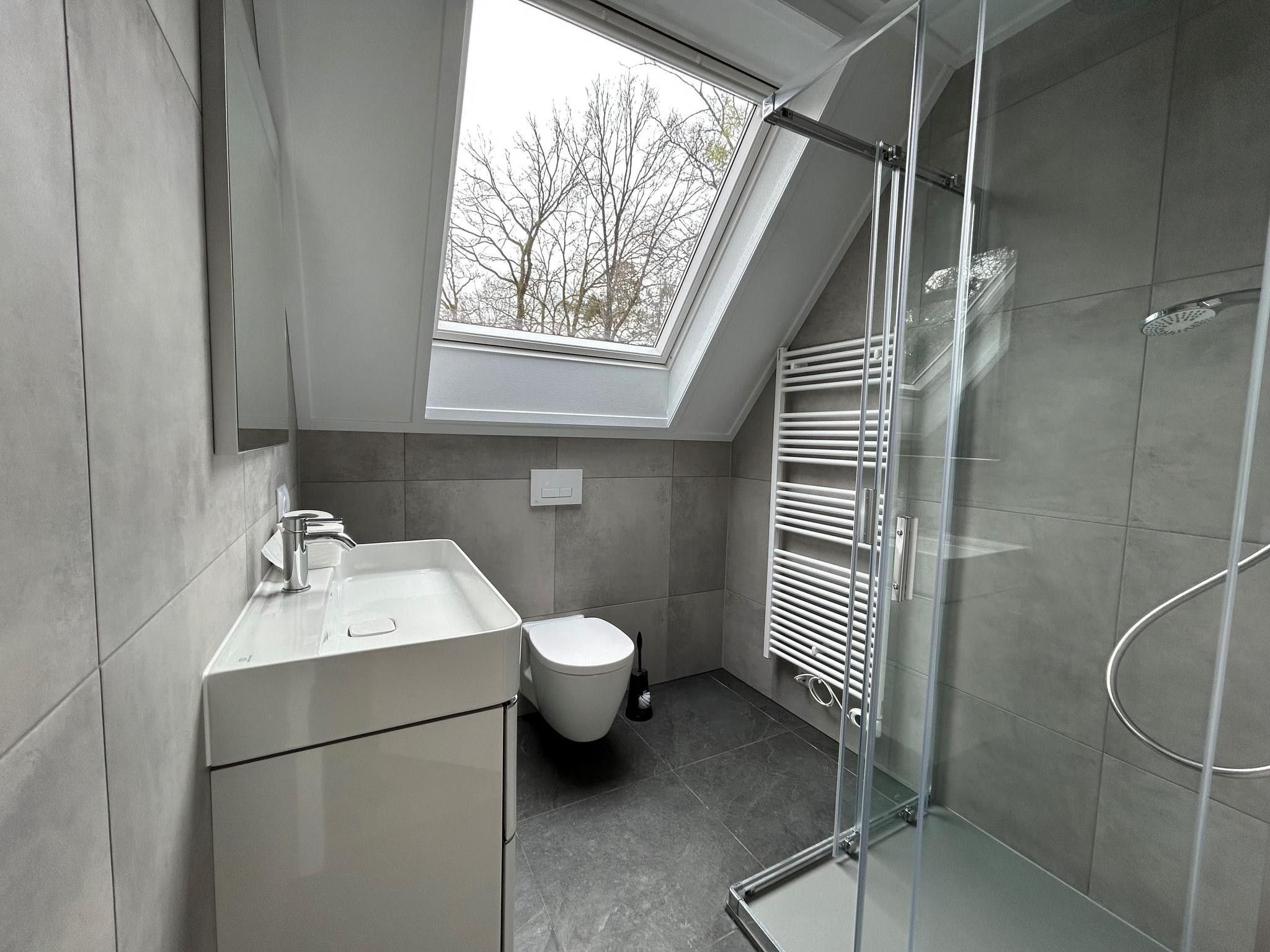 De badkamer van Vakantiepark De Rimboe & De Woeste Hoogte 2 in Hoenderloo