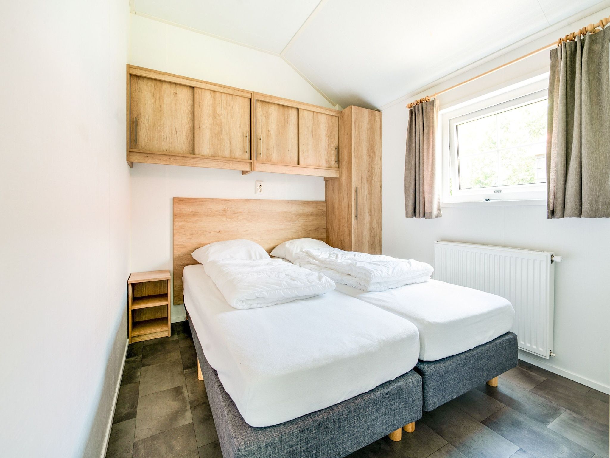 Een slaapkamer van Vakantiepark Eigen Wijze 6 in Bant