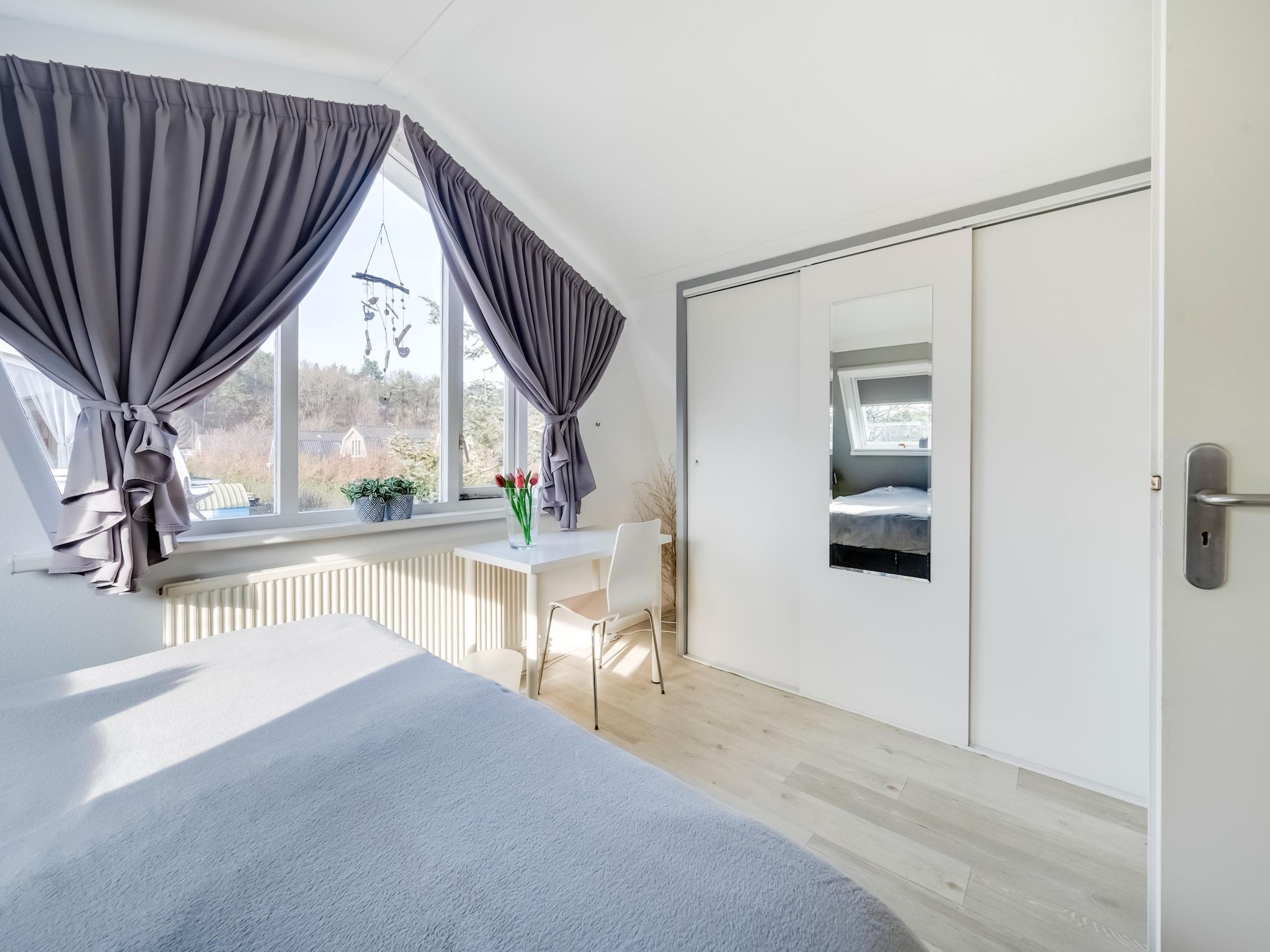 Een slaapkamer van De Zilvermeeuw in Noordwijk