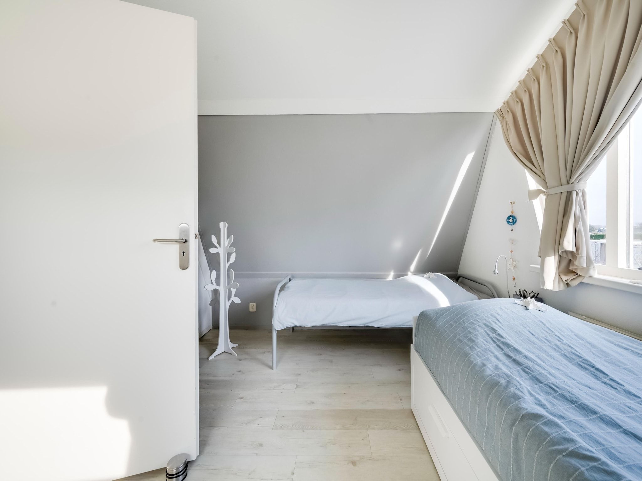Een slaapkamer van De Zilvermeeuw in Noordwijk