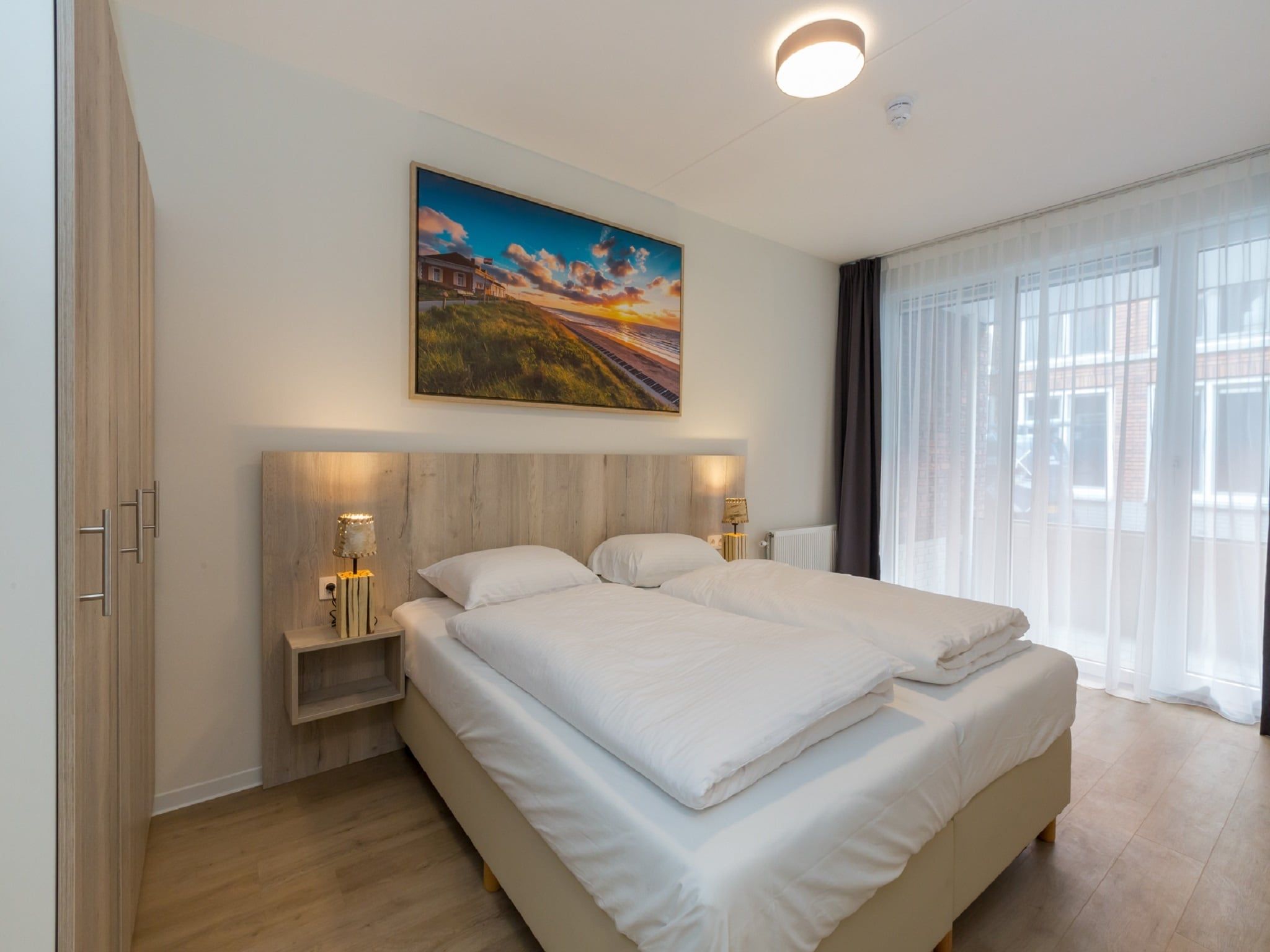 Een slaapkamer van Aparthotel Zoutelande - 6 pers luxe appartement in Zoutelande