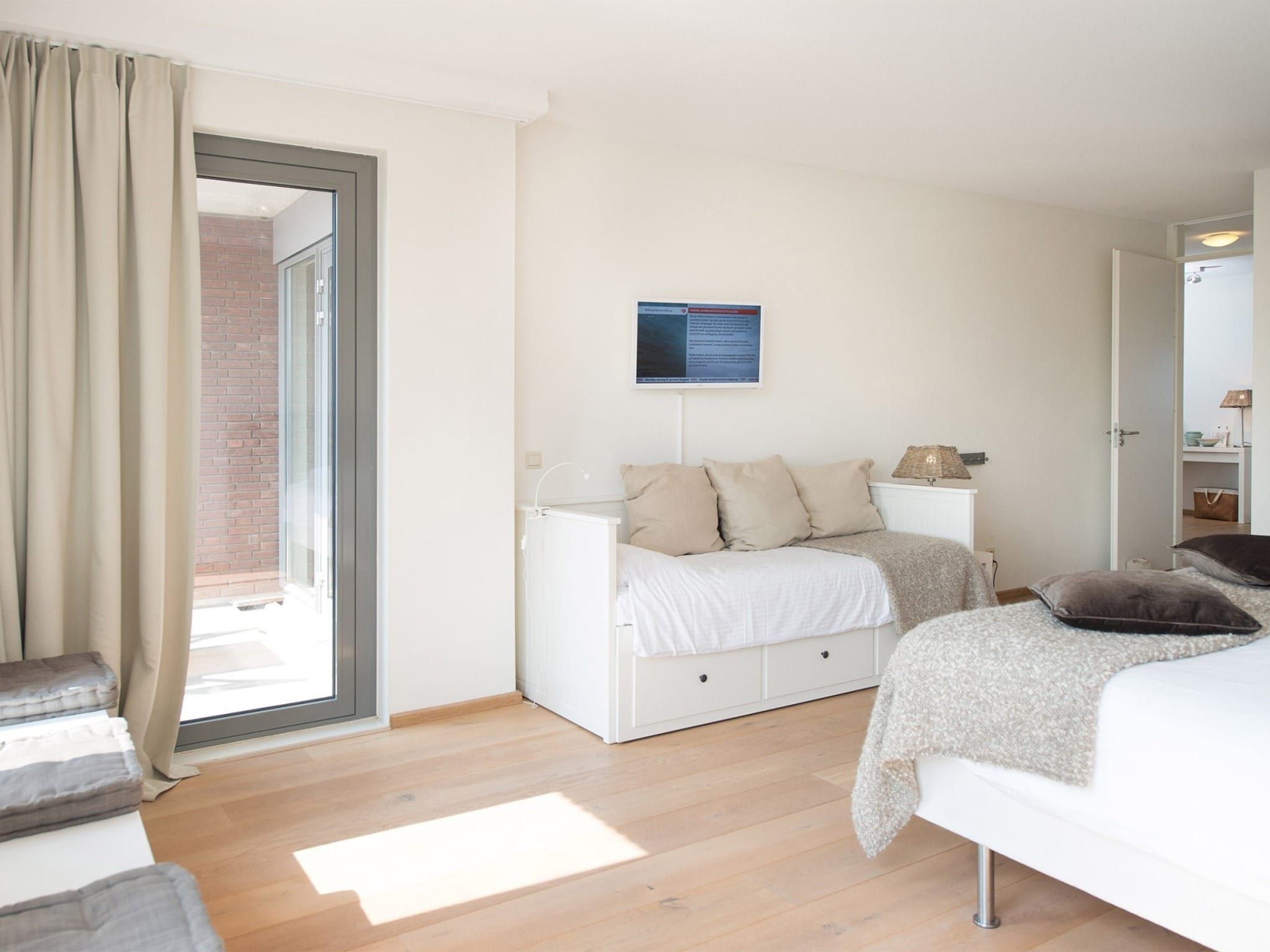 Een slaapkamer van Scheveningen Harbour 24a in Scheveningen