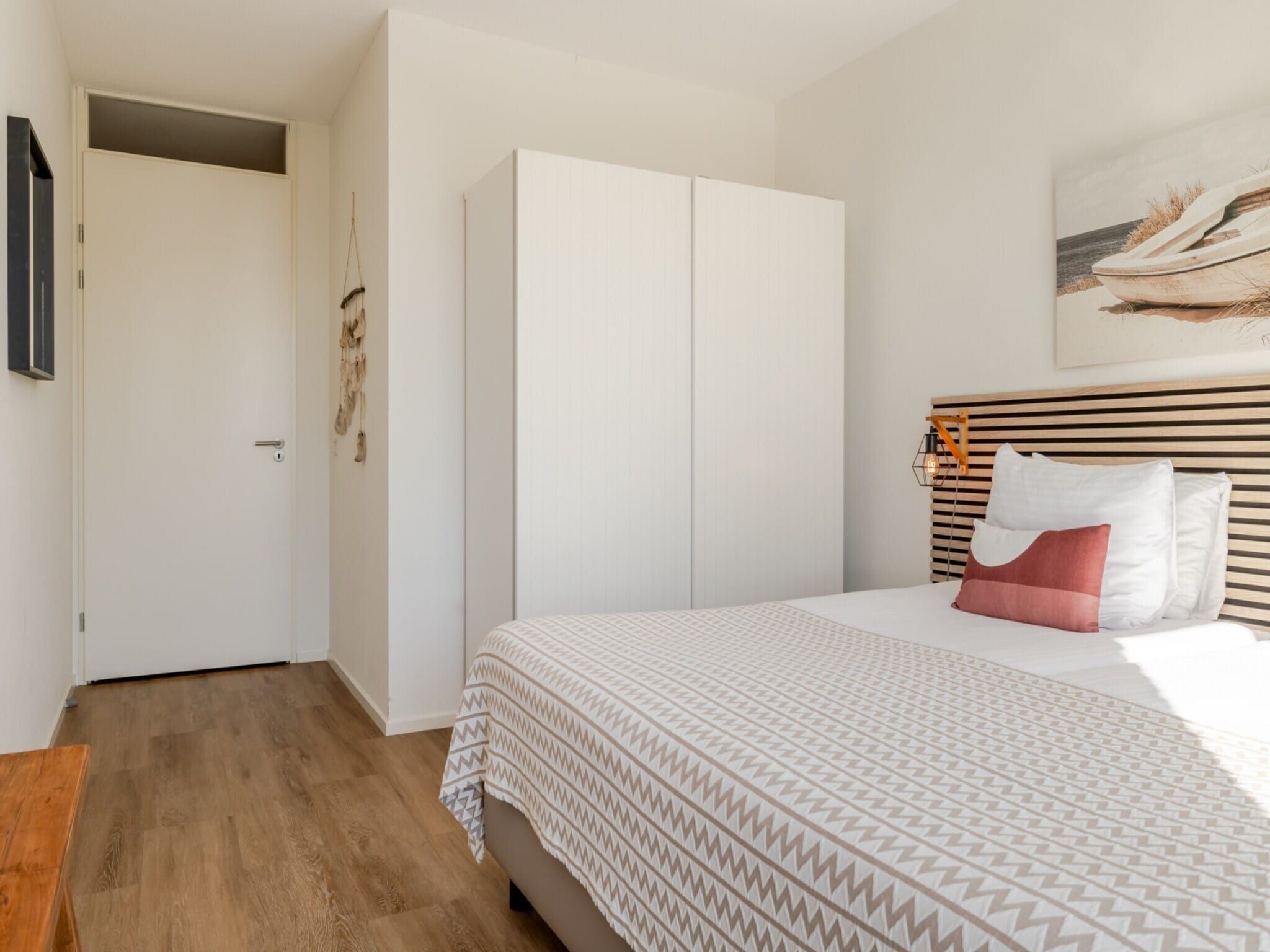 Een slaapkamer van Scheveningen Harbour 60 in Scheveningen