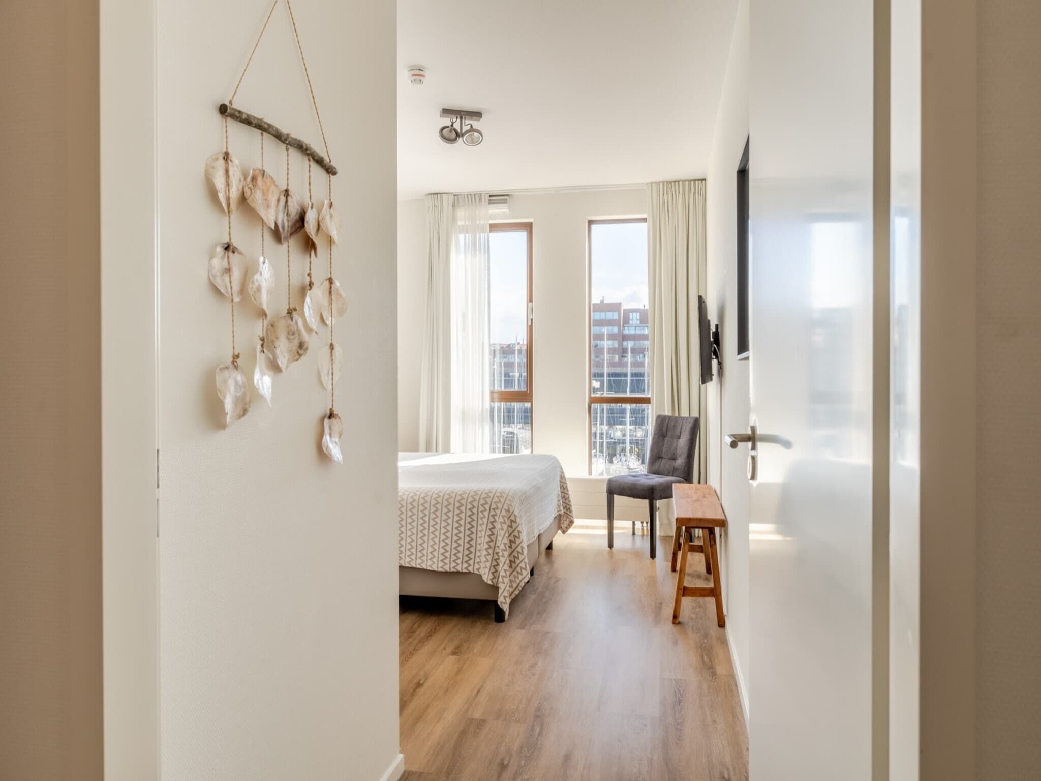 Een slaapkamer van Scheveningen Harbour 60 in Scheveningen