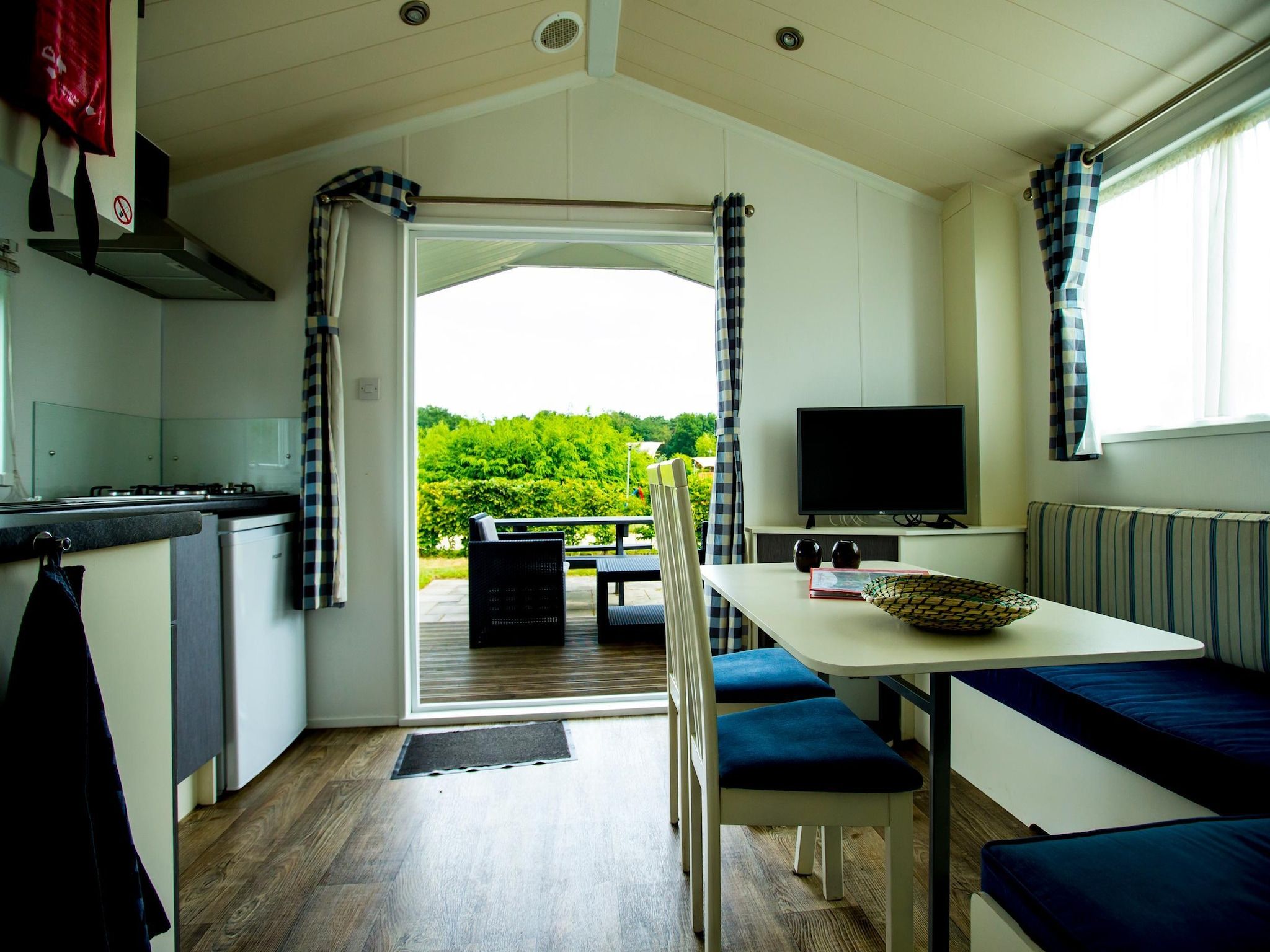 De woonkamer van Recreatiepark Duinhoeve 10 in Udenhout