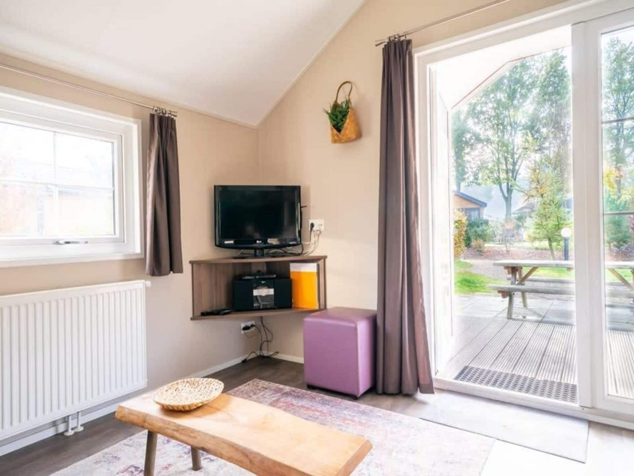 De woonkamer van Boslodge 6 in Otterlo